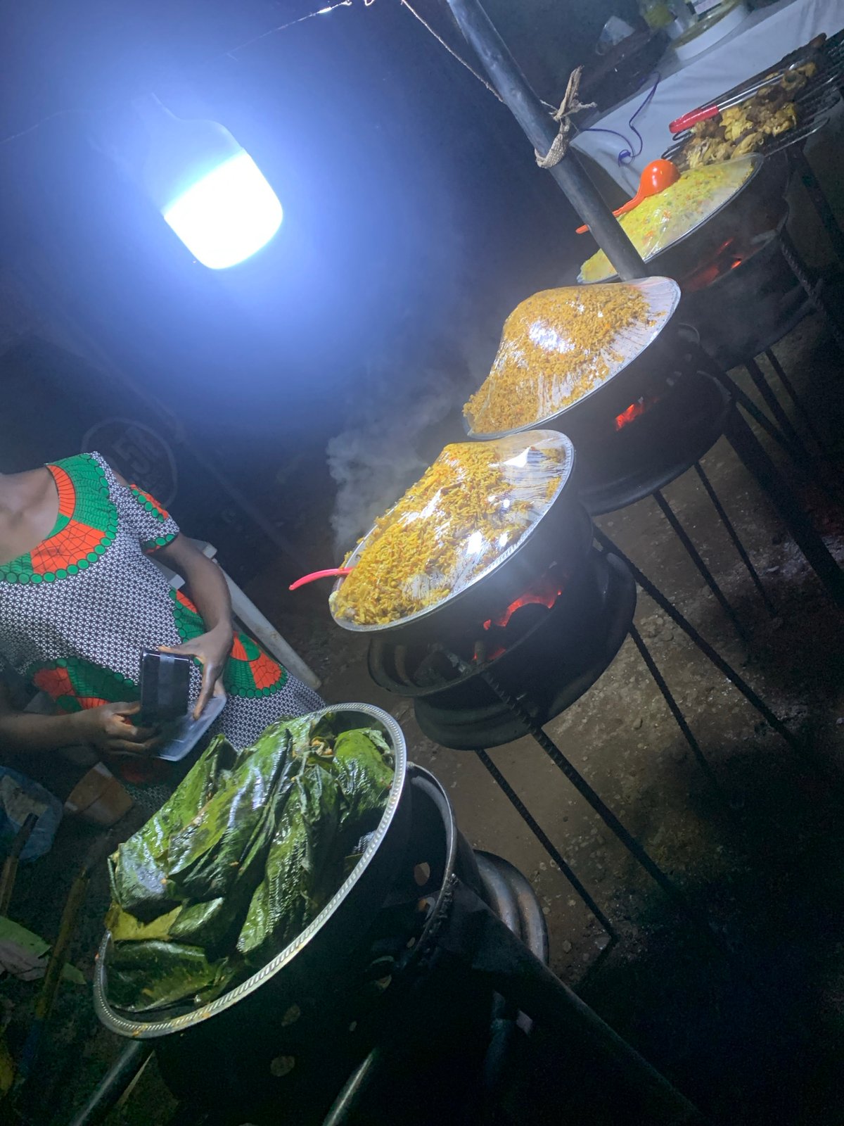 Street vendor prepares traditional dishes in Gwarinpa, Nigeria