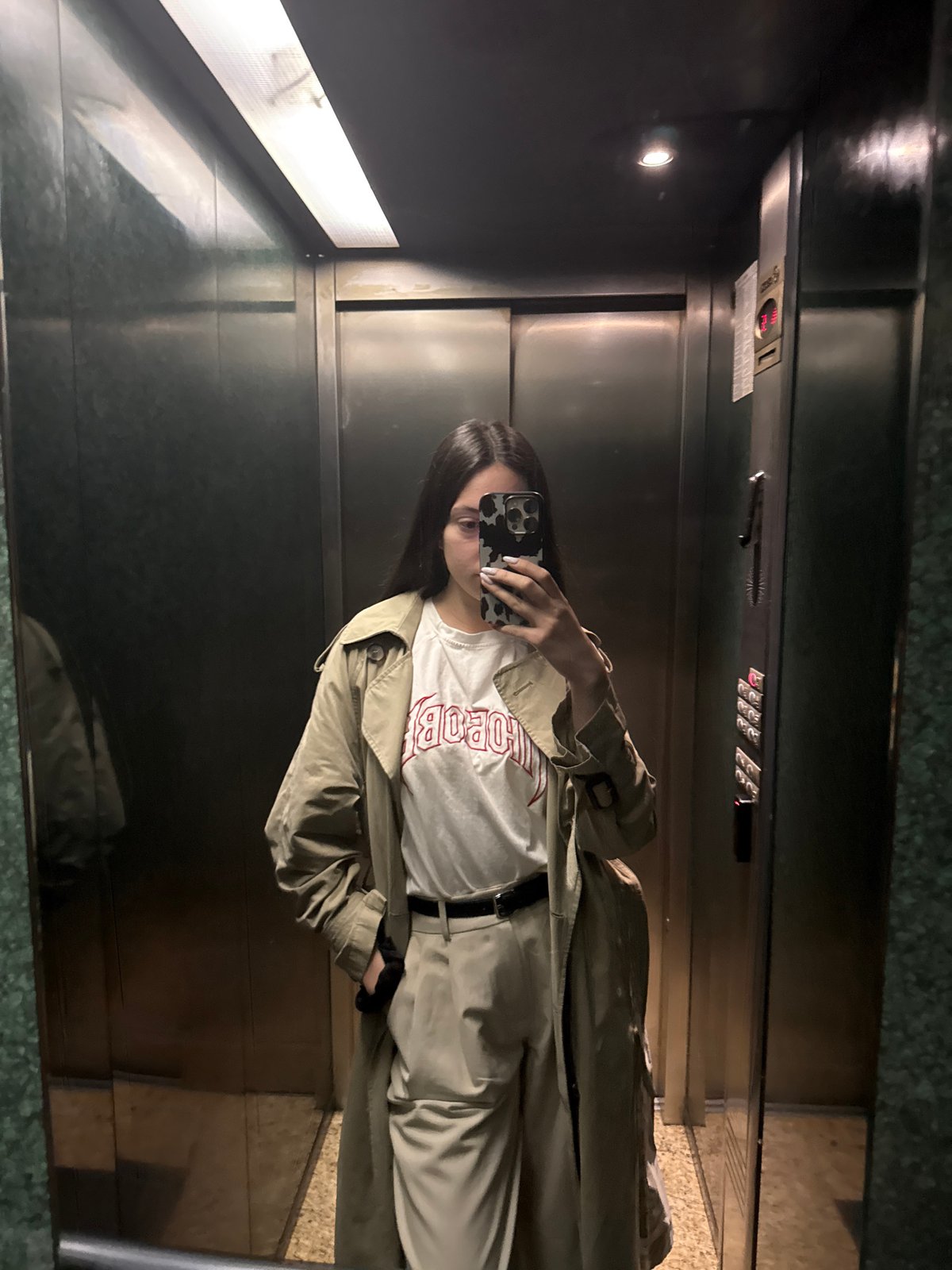 Woman takes selfie in Sofia luxury hotel elevator