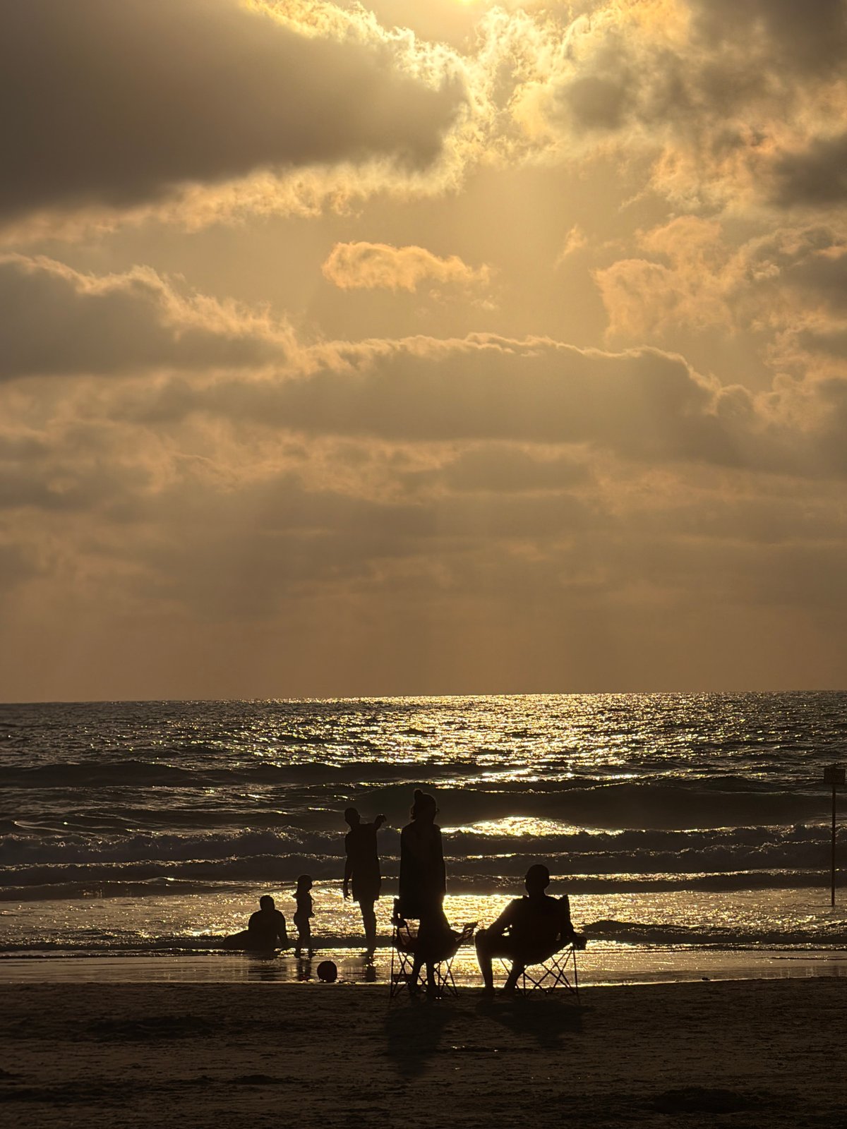 Late afternoon at the Bat Yam shoreline, golden hour winding down.