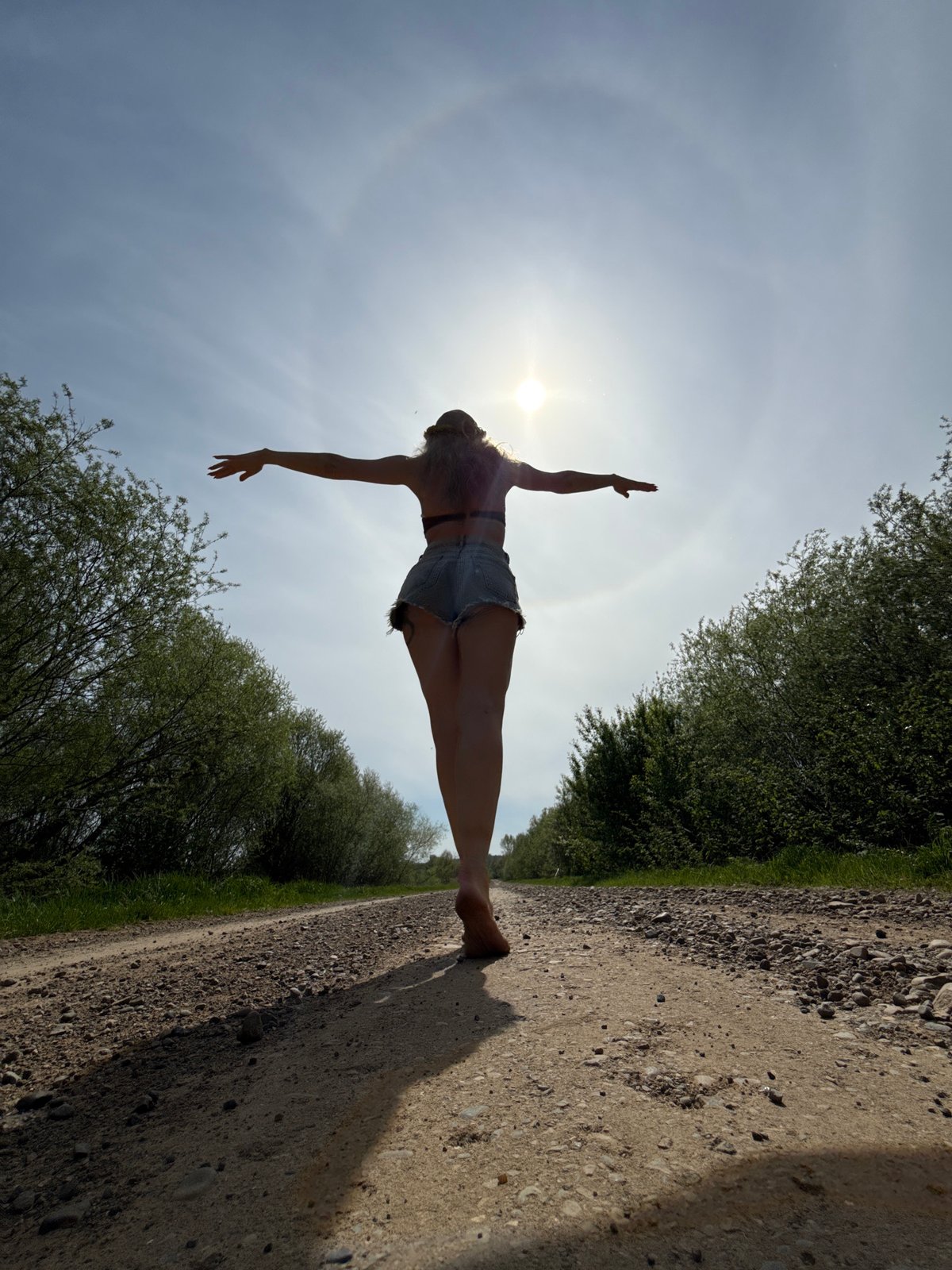 Woman poses for rural photo session in Russian countryside
