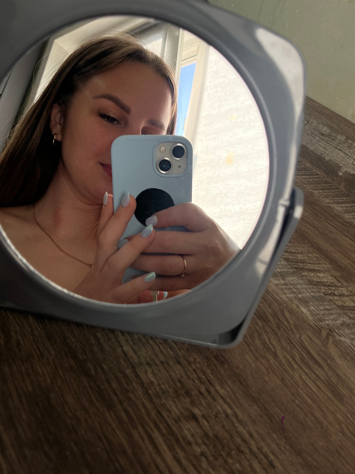 Woman takes late-night mirror selfies in Izhevsk apartment