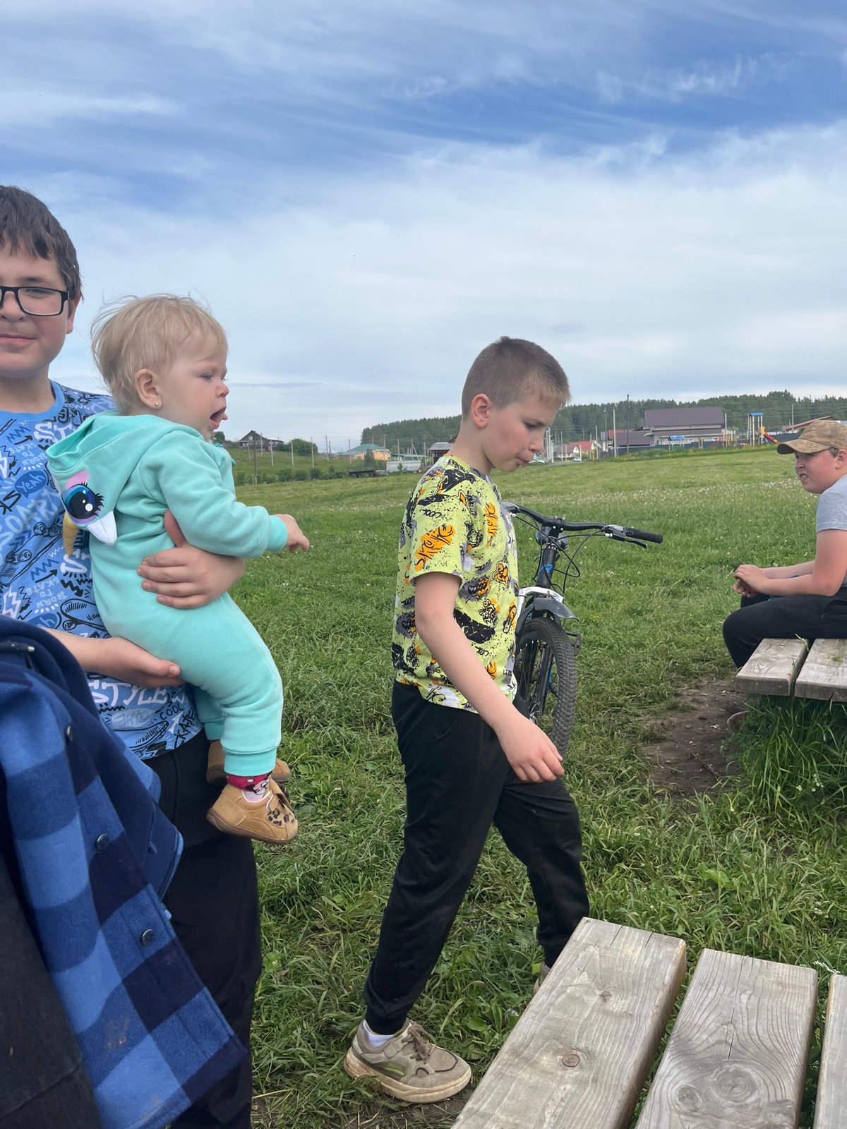 Family outing documented by lake in rural Russia