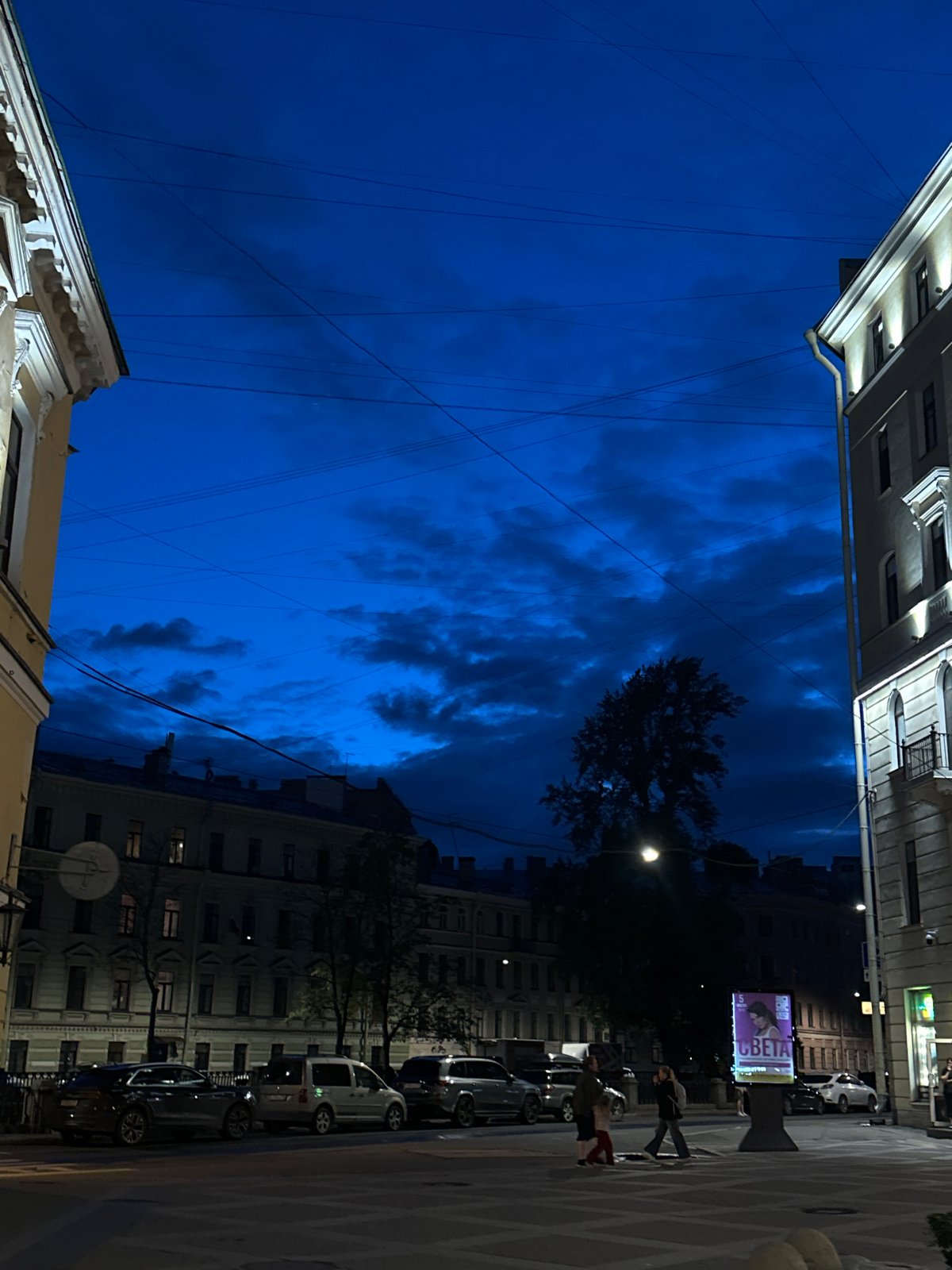 Evening stroll captures illuminated historic buildings in European city