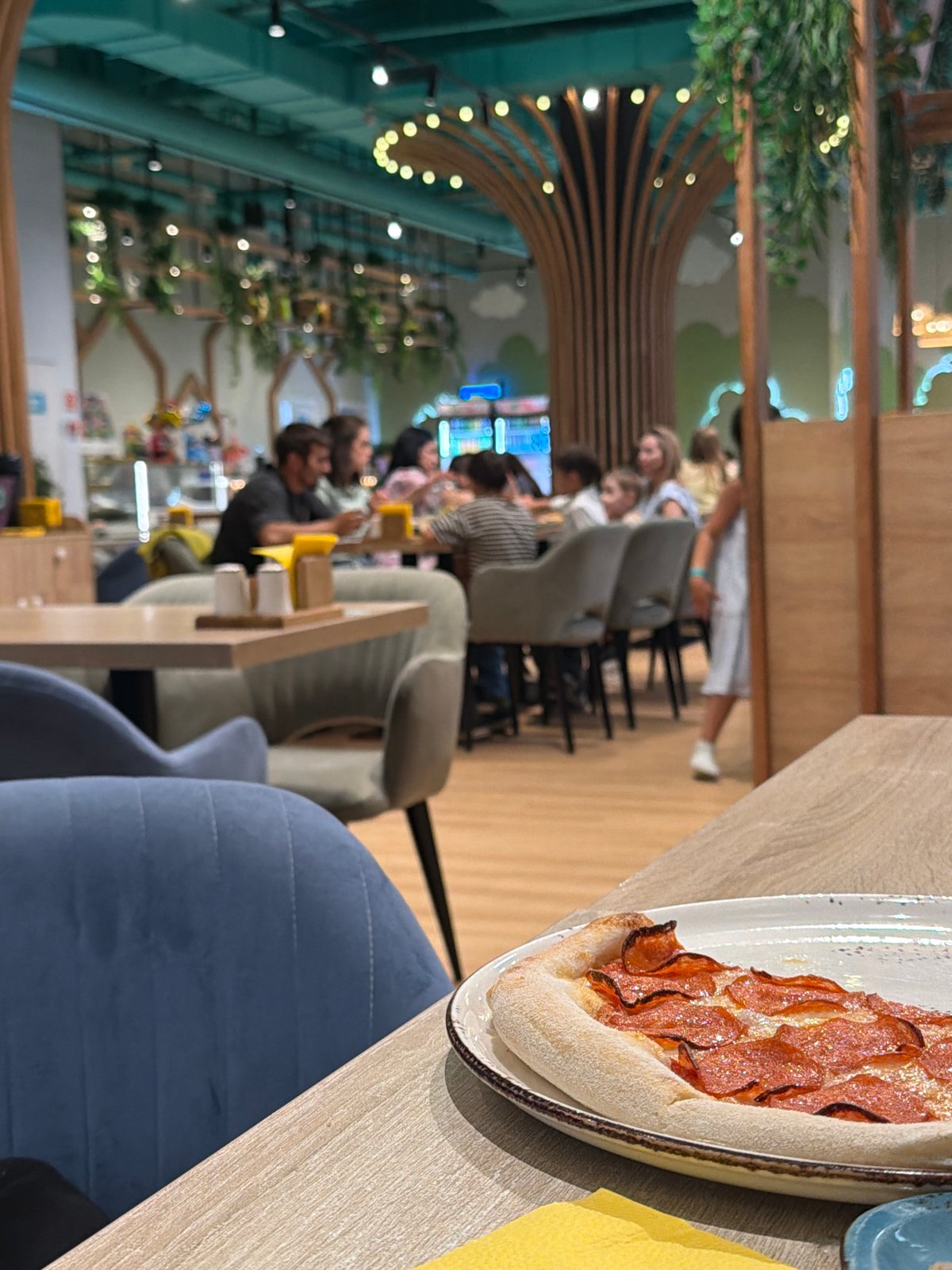 Pizza, sushi, and milkshake menus at a Kazan themed cafe
