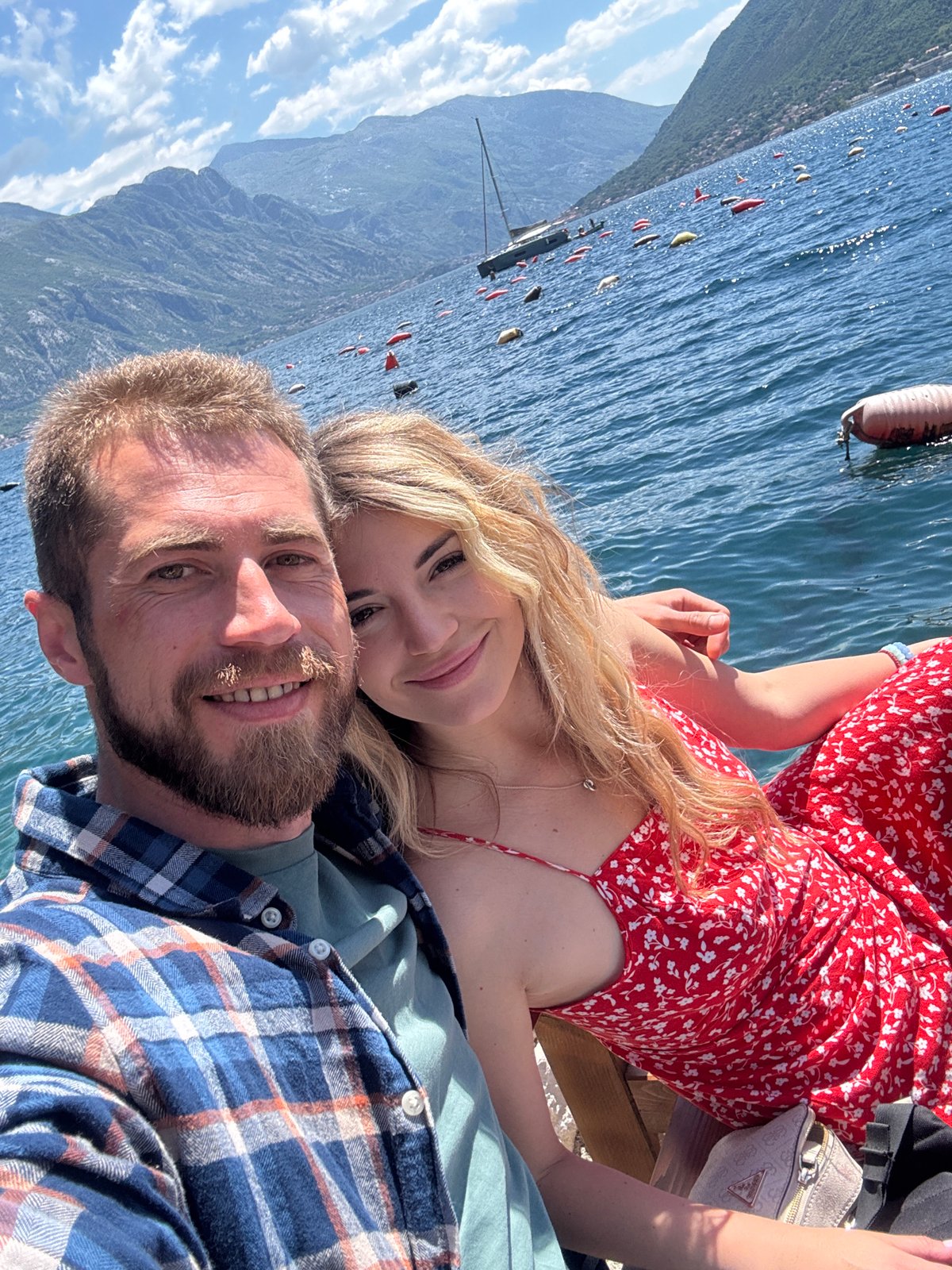 Couple enjoys seafood dining and seaside recreation in Montenegro