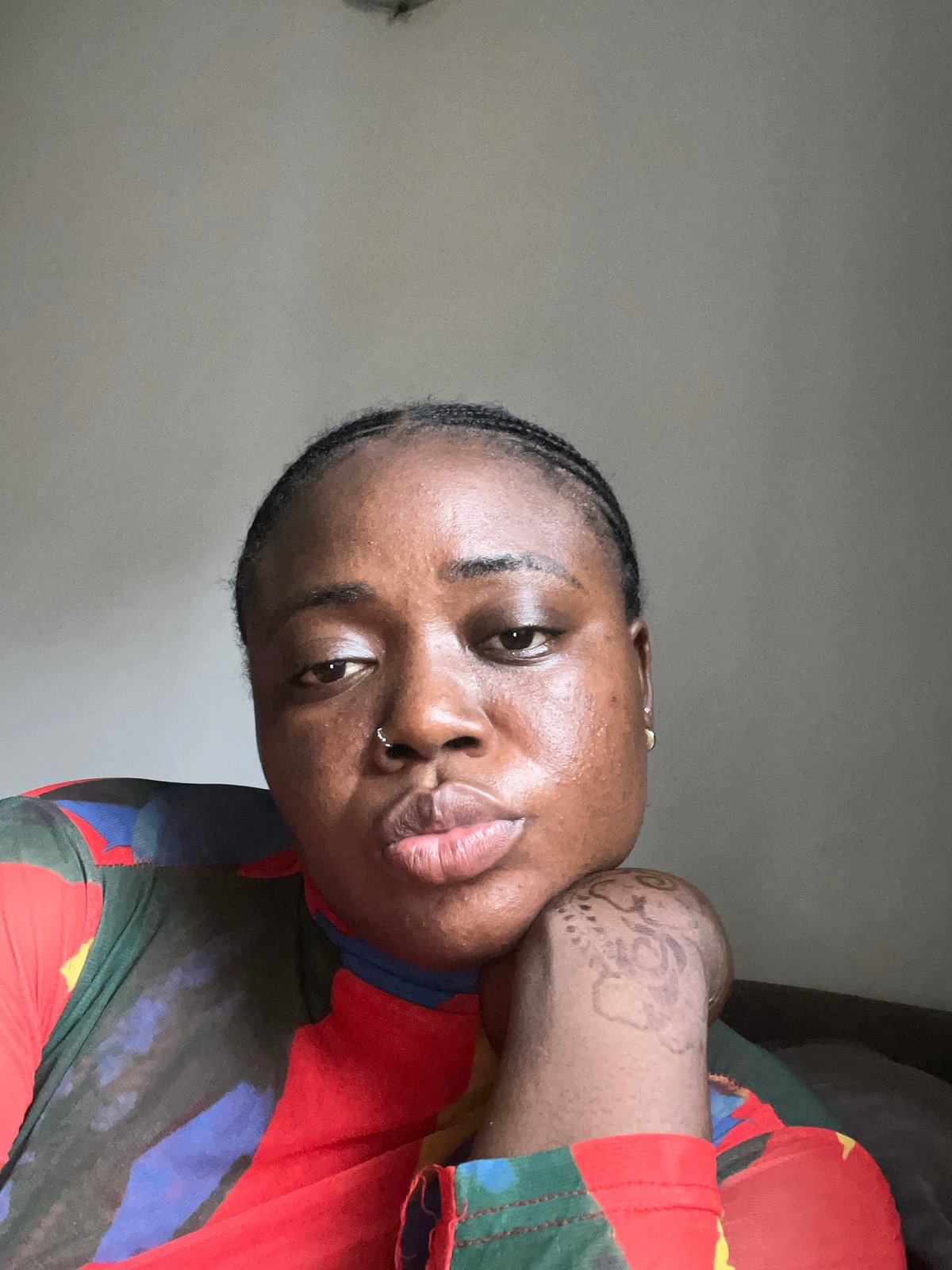 Person takes colorful selfie session in Abuja home