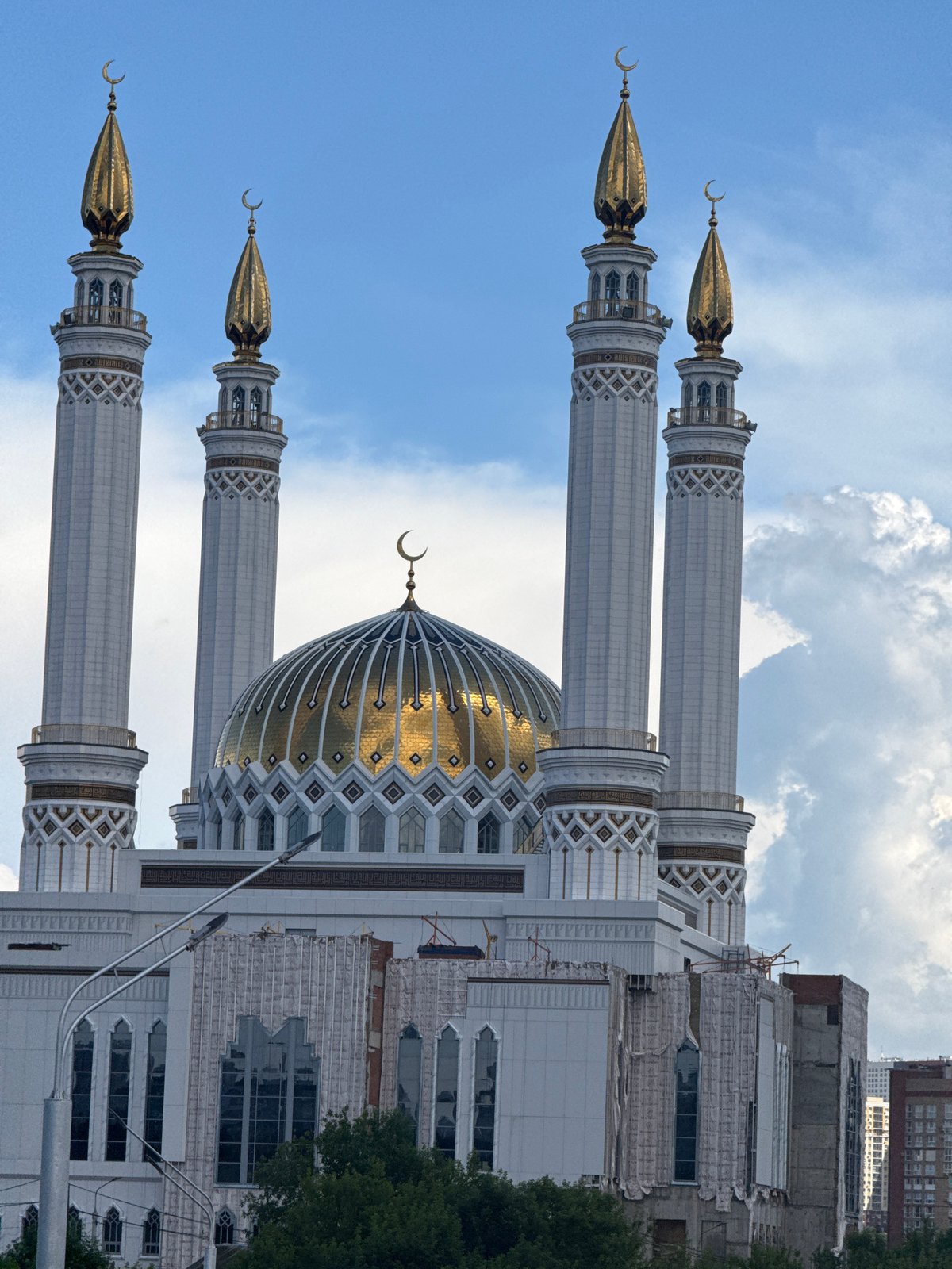 Drive through Kazan featuring mosque views and spring flowers