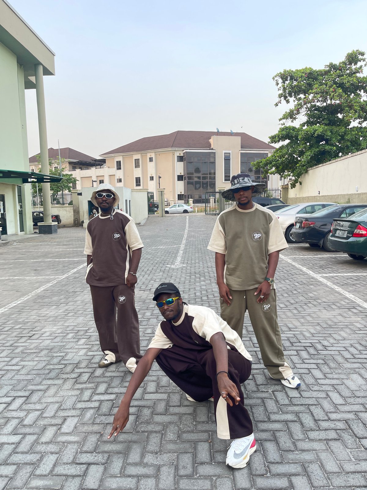 Young men pose for street style photos in Abuja