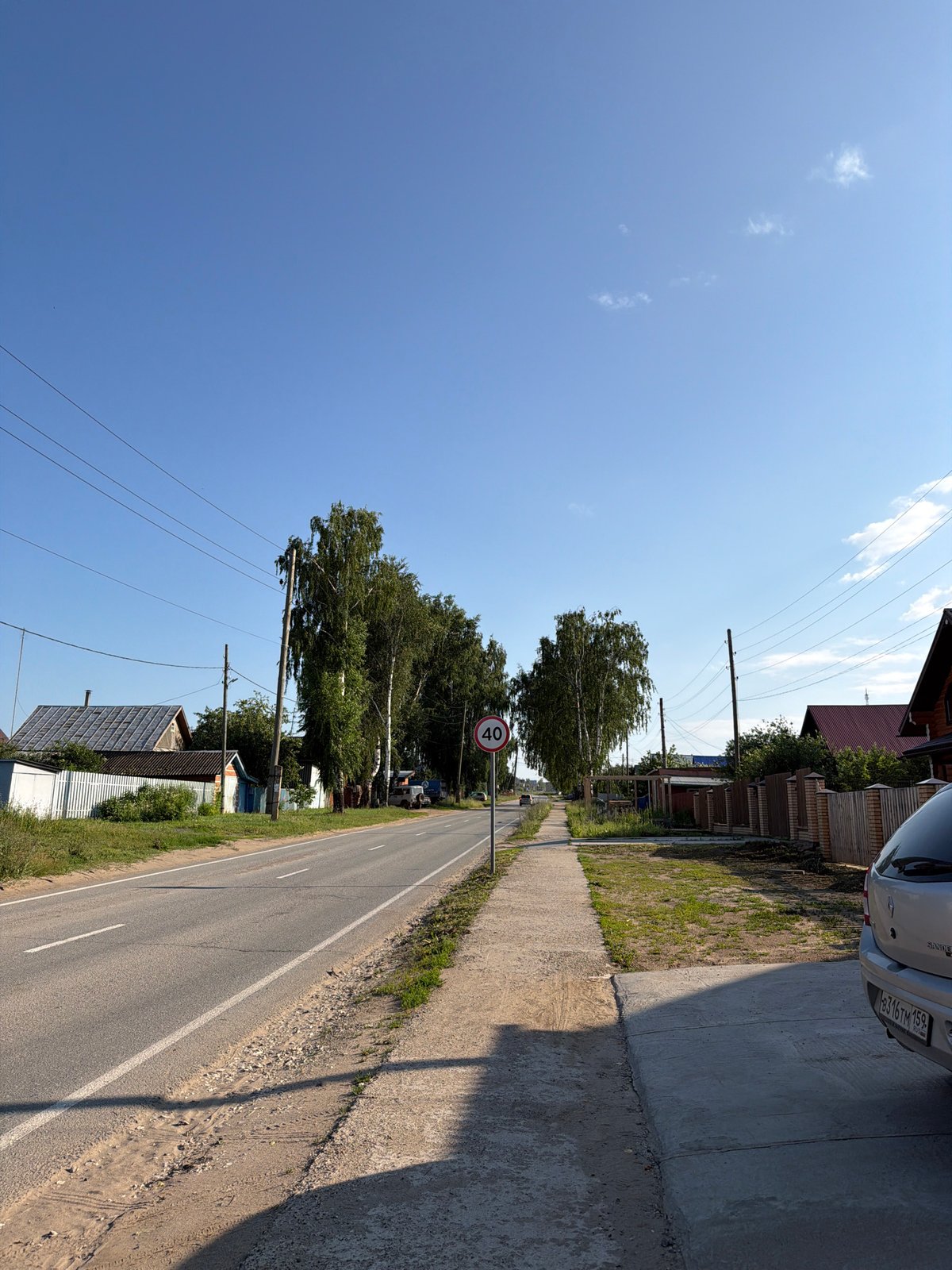 Quiet summer streets and wooden houses in Chaikovsky, Russia