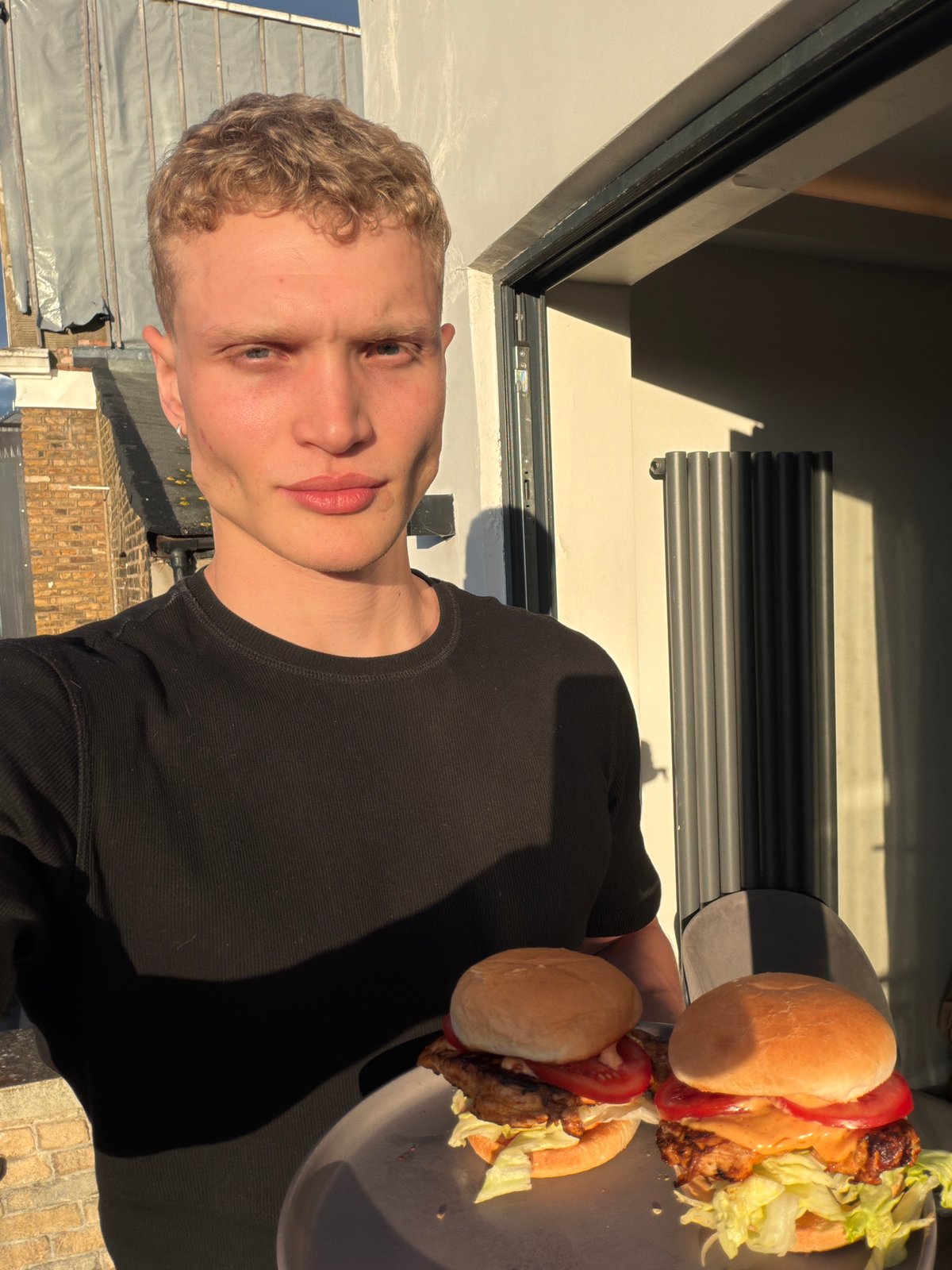 Young man spotted on London rooftop terrace evening