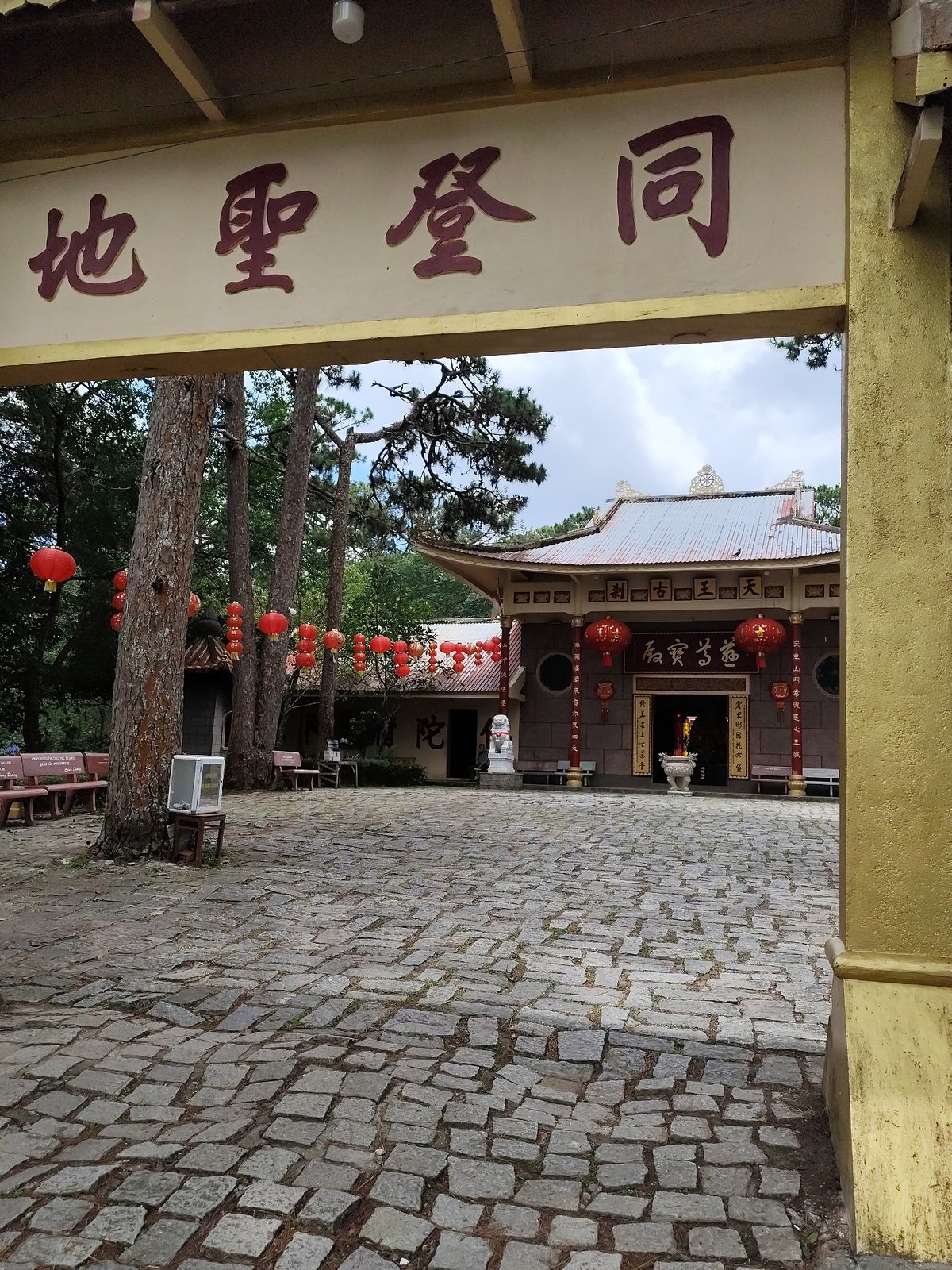 Early morning documentation captures Buddhist temple and residential architecture in Da Lat