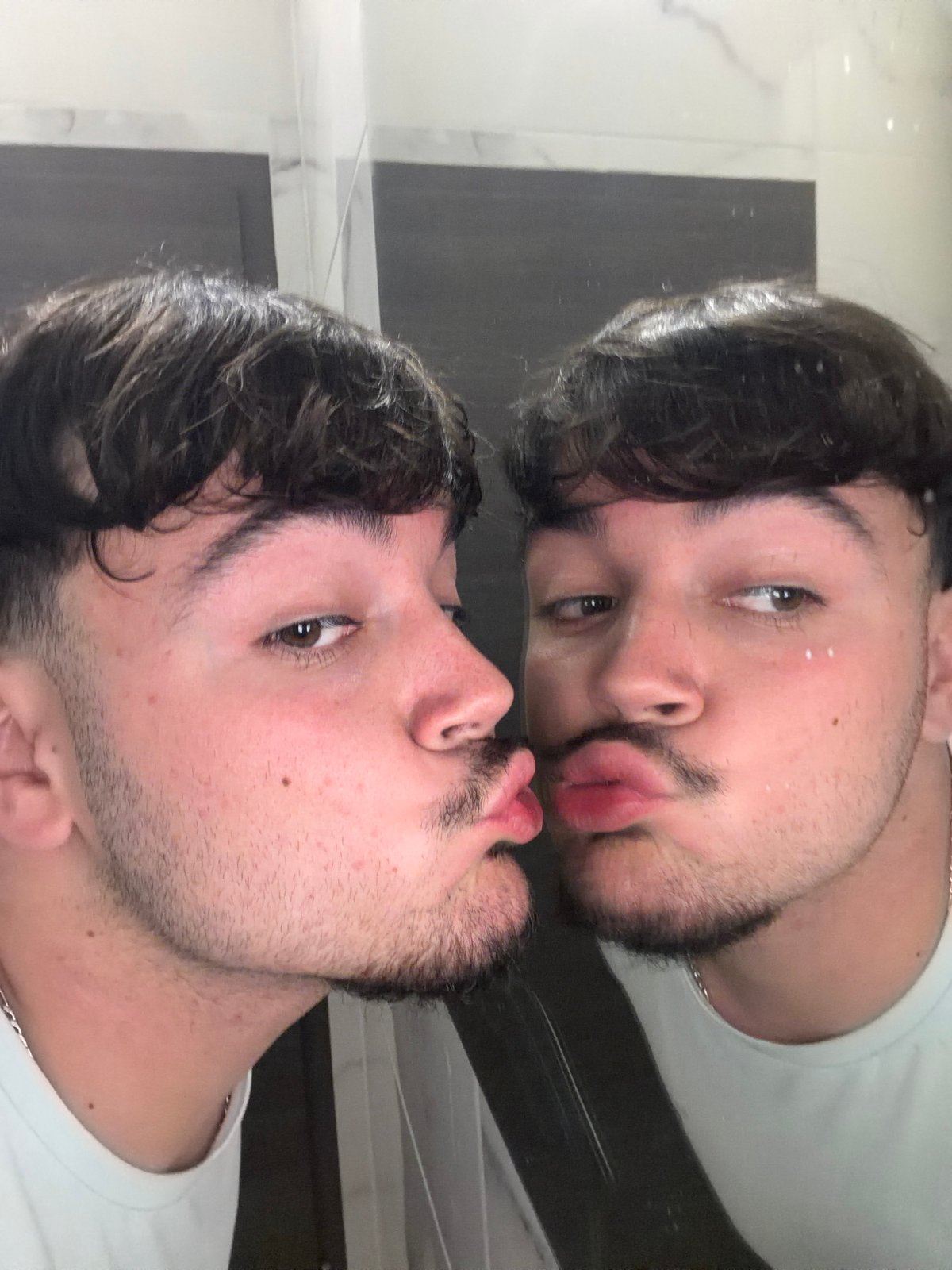 Bathroom mirror moment and kiss hashtag captured in Rijeka
