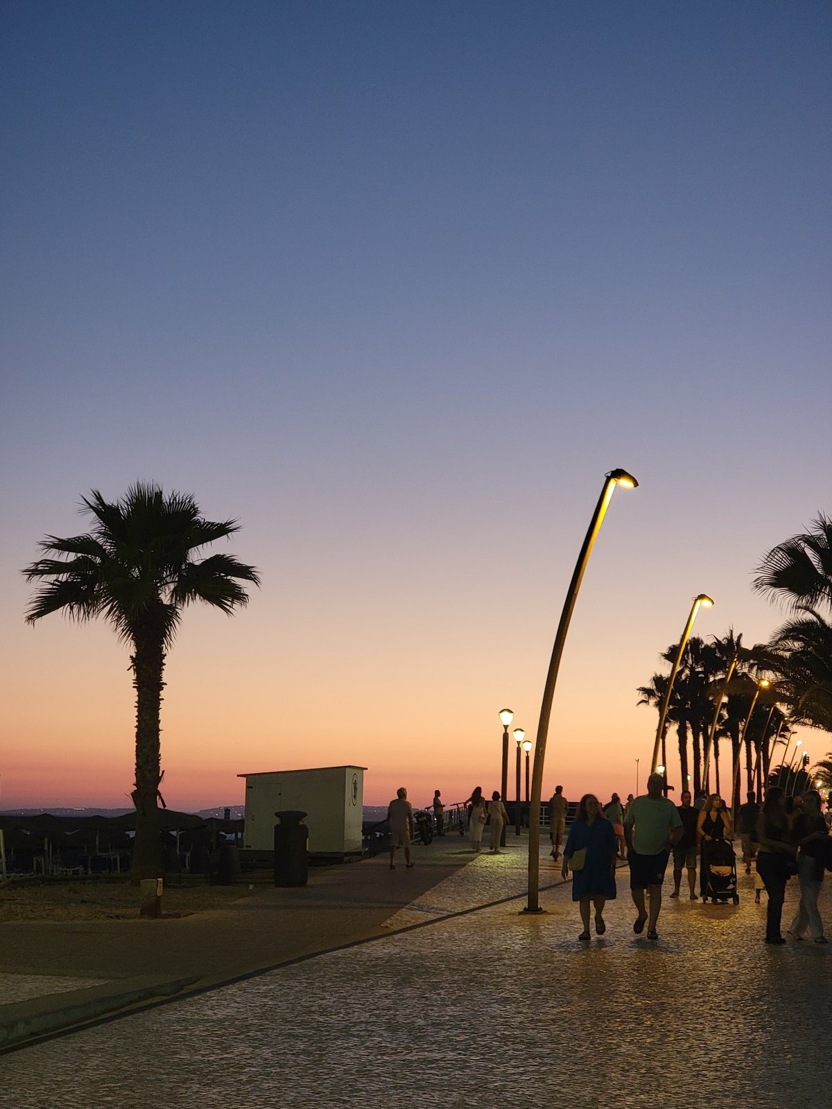 Quarteira beachfront at golden hour into night