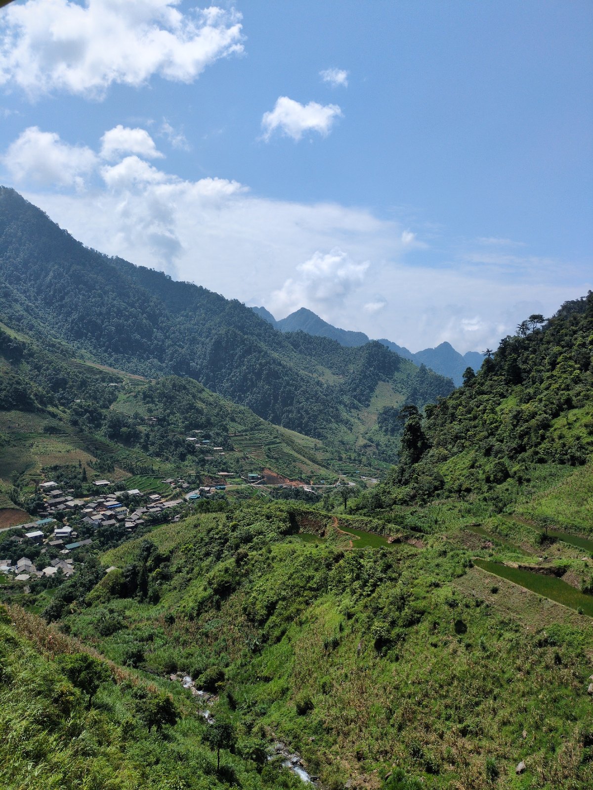 Terraced rice paddies and forested peaks in Minh Sơn valley