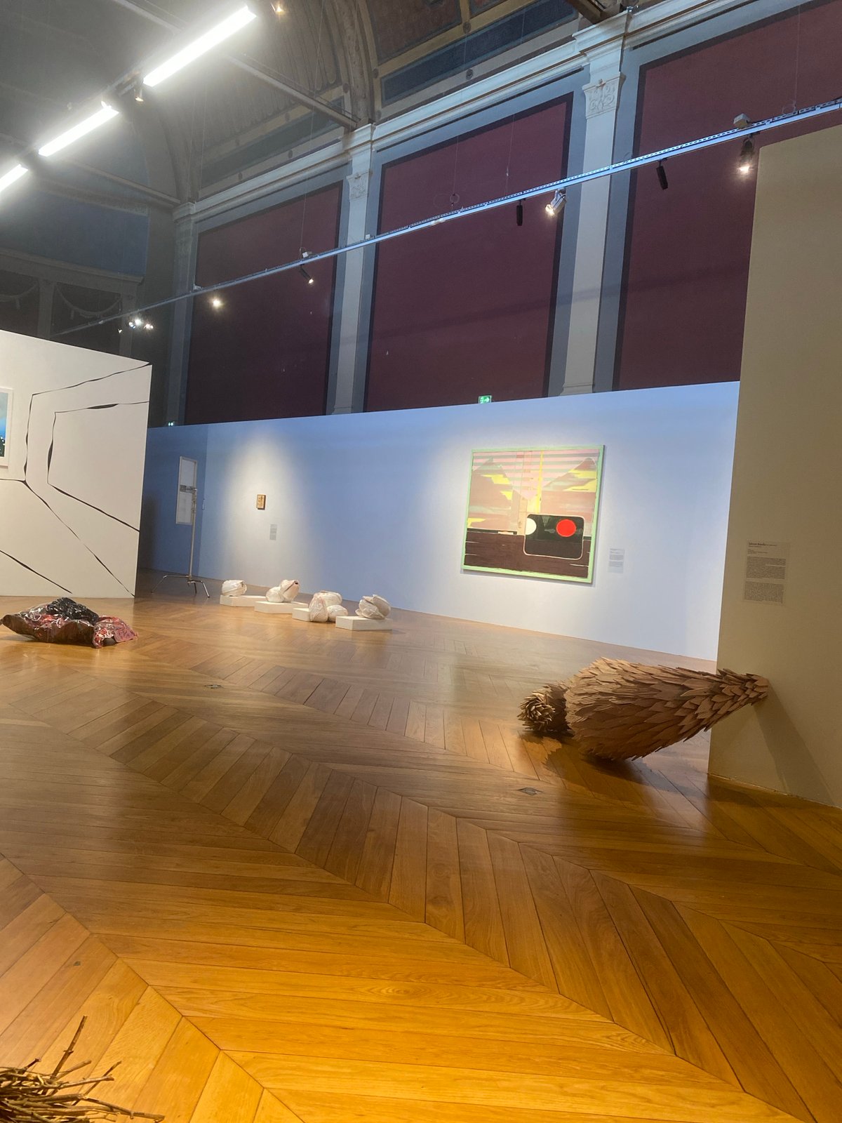 Gallery interior with herringbone flooring documented in Paris