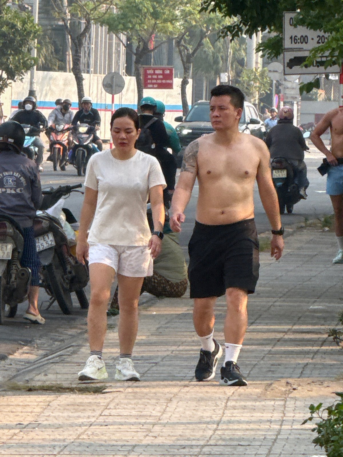 Two men spotted on sidewalk in Đà Nẵng, Vietnam