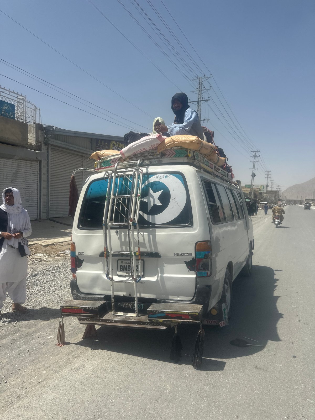 Overloaded Toyota Hiace van parked roadside in Quetta