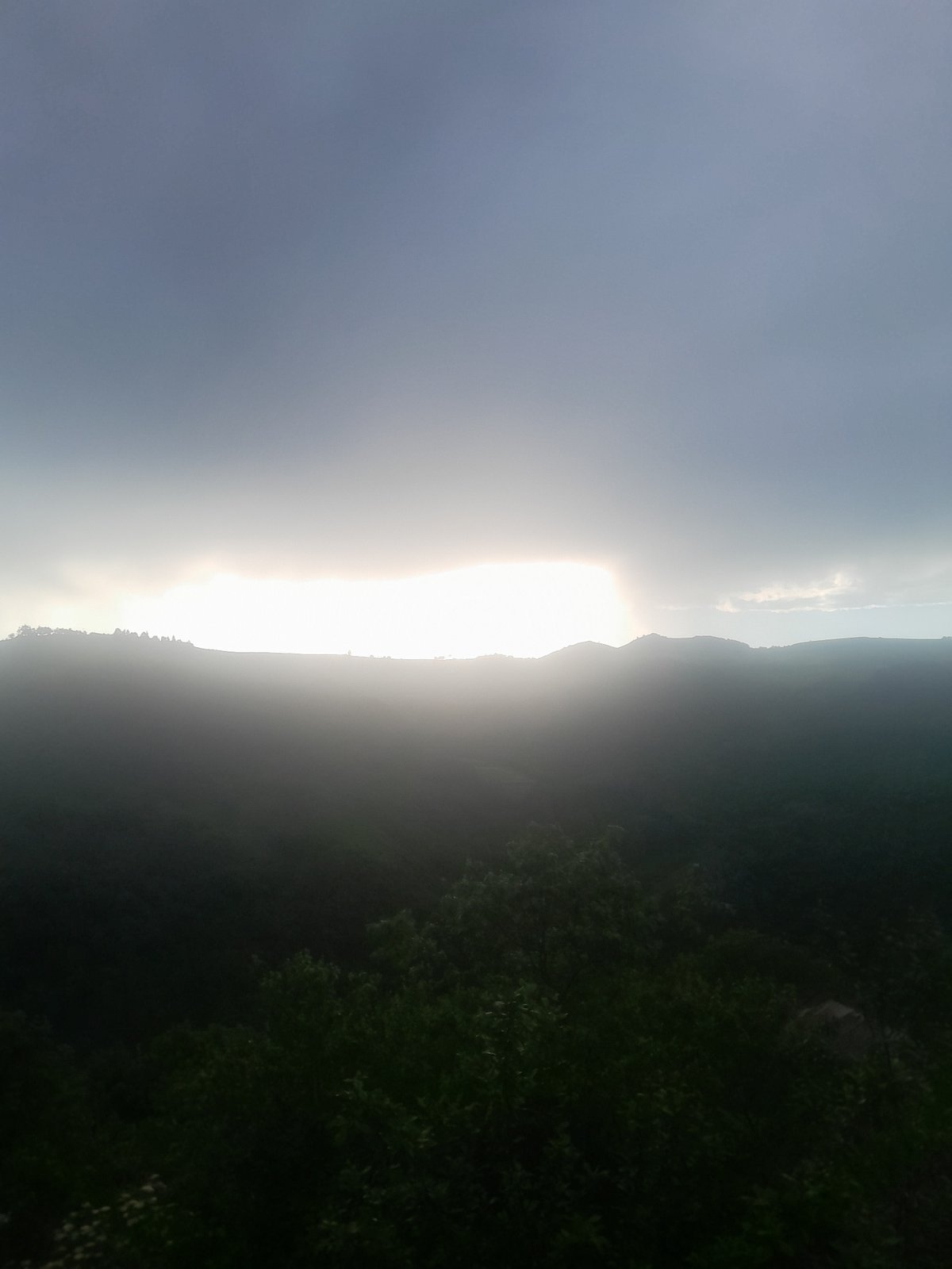 Dramatic lighting shifts captured over Armenian mountain landscape