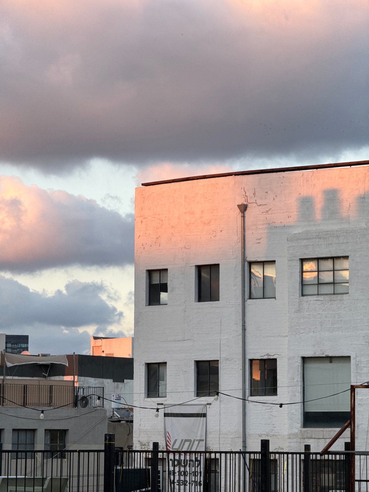 Storm clouds gather over Tel Aviv urban landscape