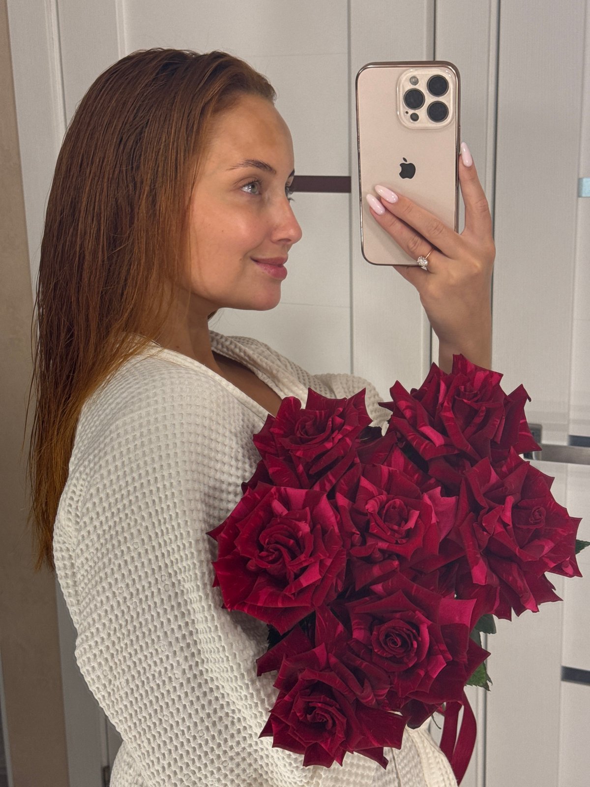 Red roses and backyard apple trees in Chaikovsky