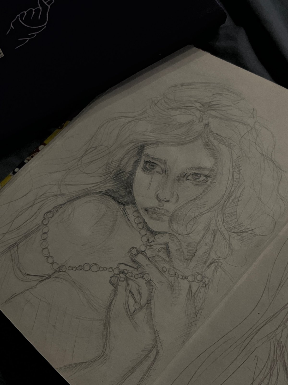 Sketchbook art session: portraits, paintings, and creative workspace