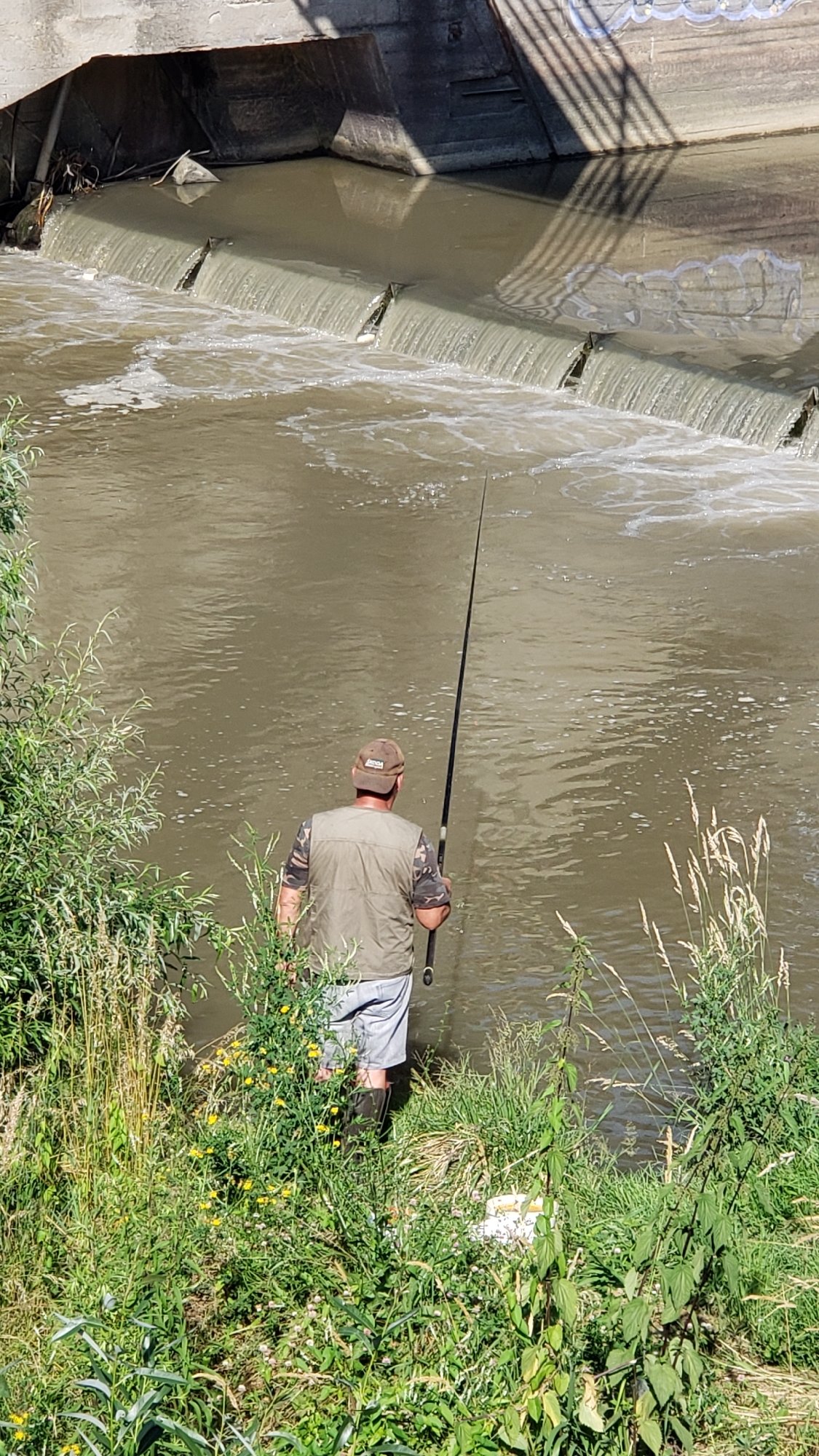 Riverside morning in Prešov: nature, graffiti, and fishing
