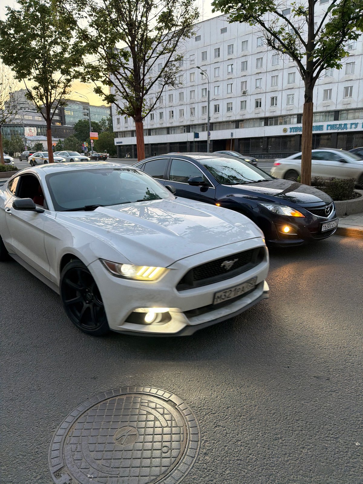 Two cars with Russian plates parked on Moscow street