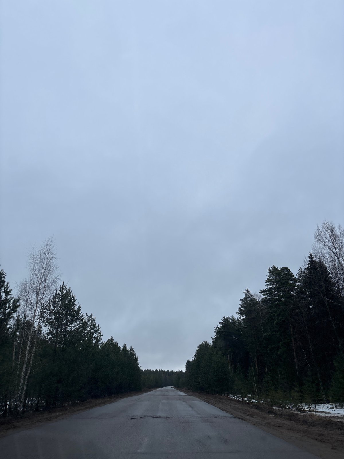 Wet road conditions documented near Chaikovsky, Russia early morning
