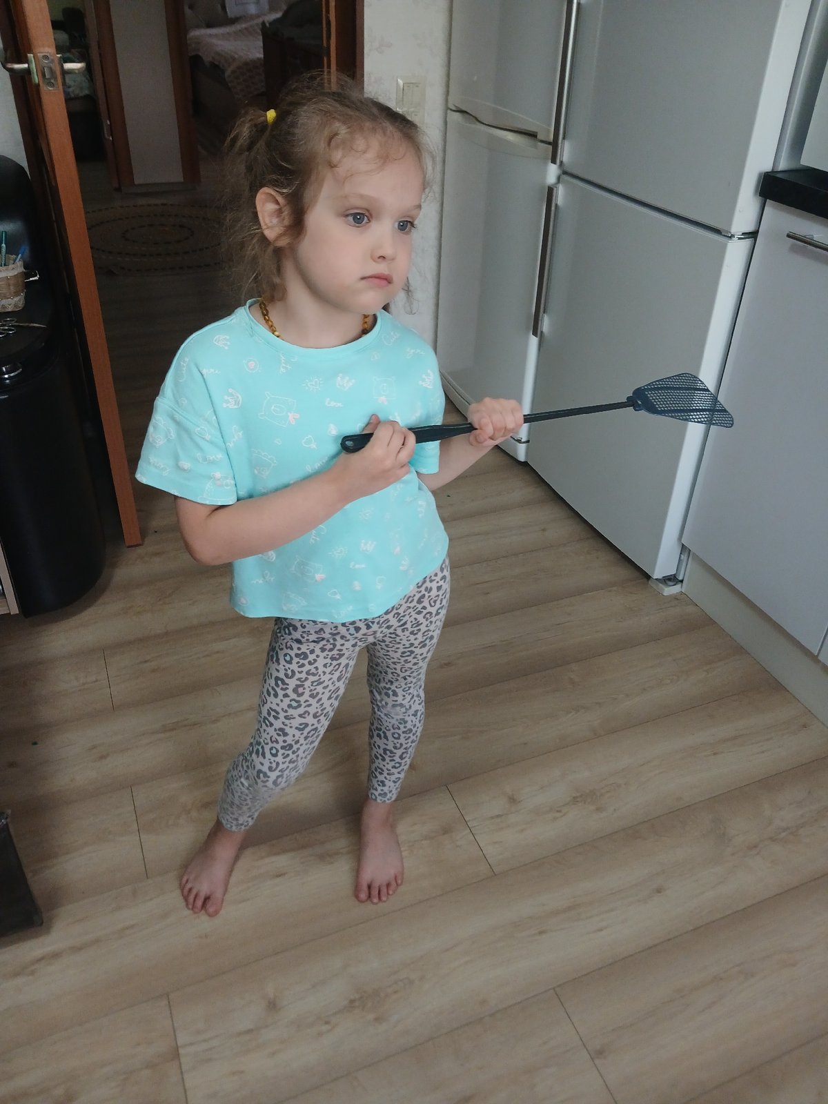 Barefoot at home, rolling out dough on a quiet morning