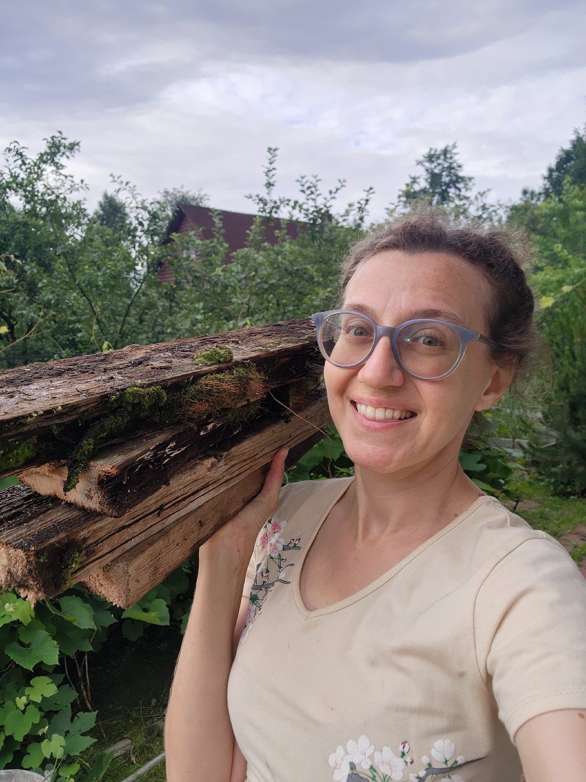 Garden check-in: roses, squash, firewood, and a silly face