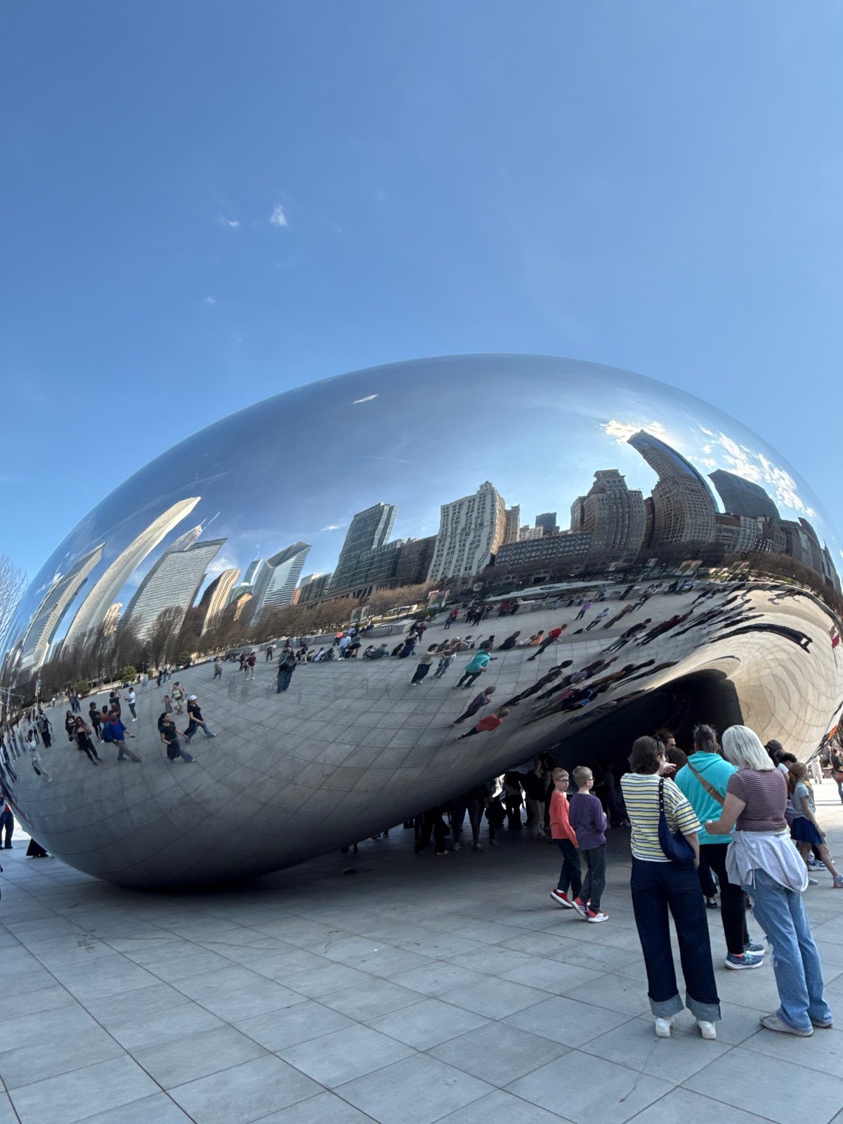 Visitors gather at Chicago's Cloud Gate sculpture in Millennium Park