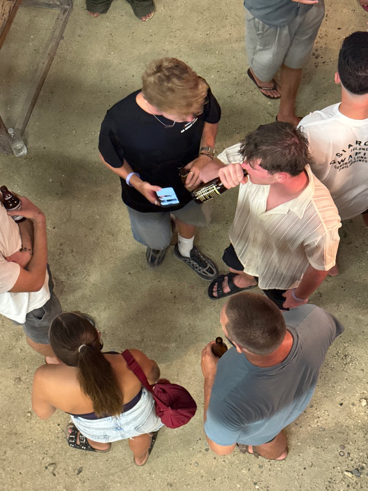 Young adults gather for outdoor drinking games in General Luna