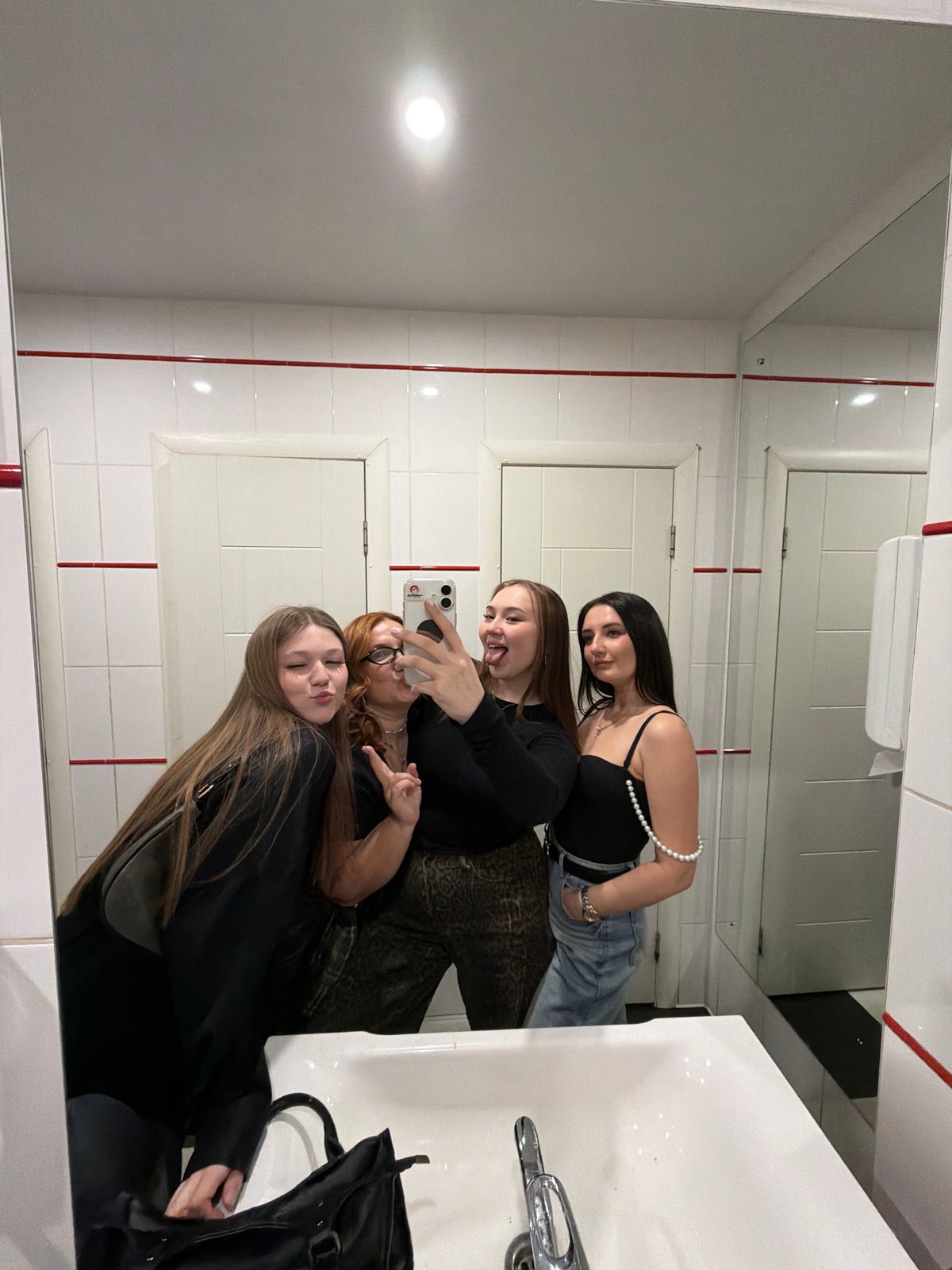 Women take bathroom selfies in Chaikovsky public restroom