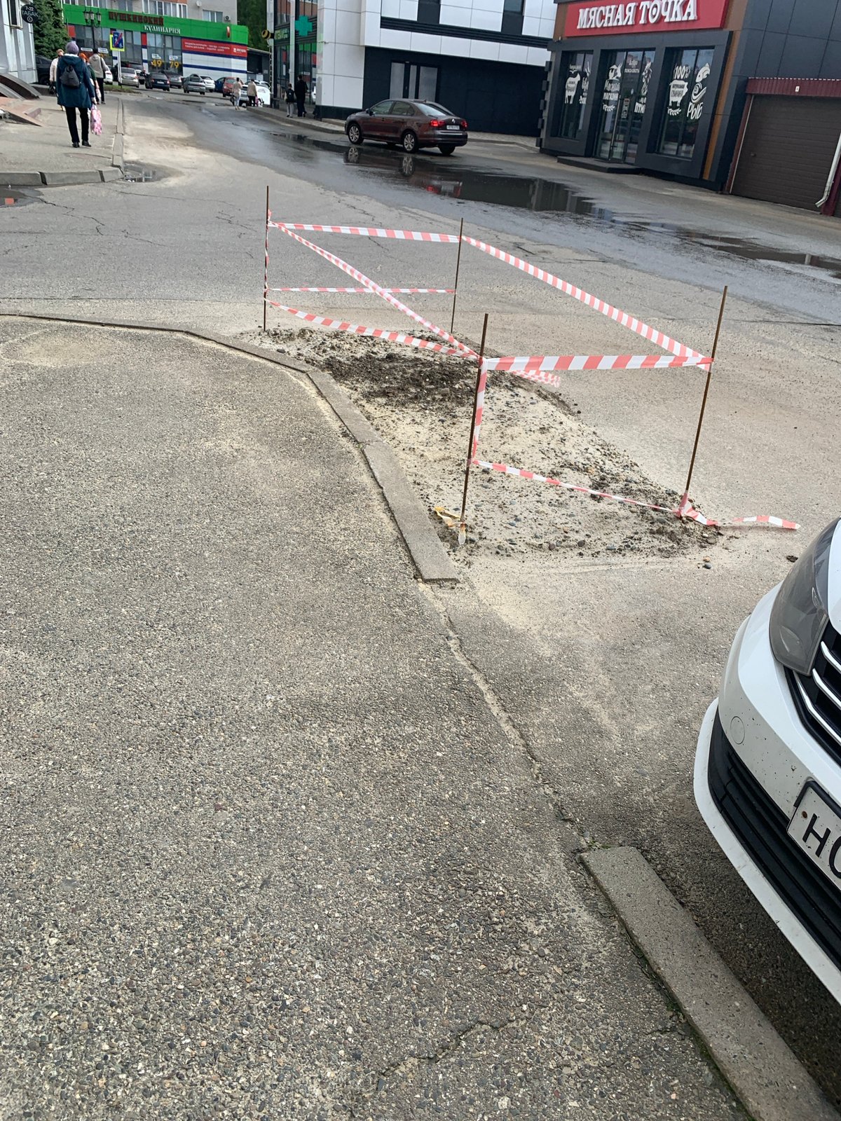 Road hazard cordoned off with caution tape in Stavropol