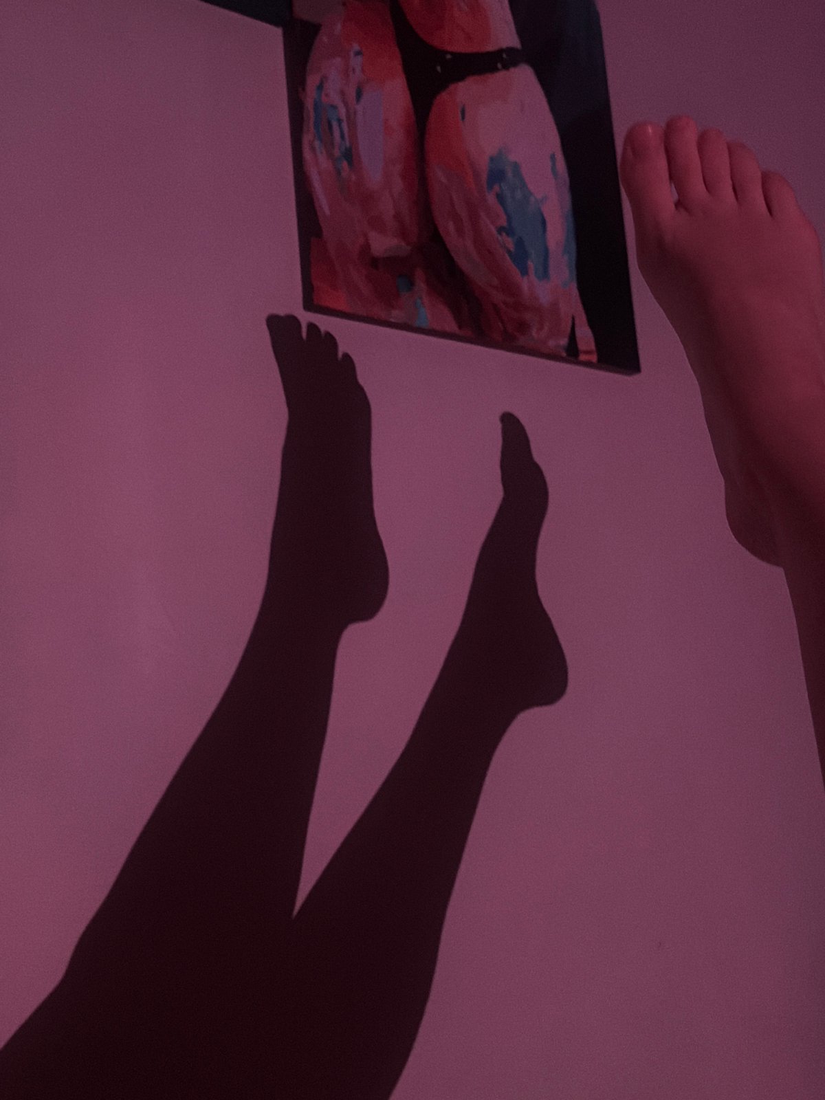 Person photographed in bedroom setting in Moscow