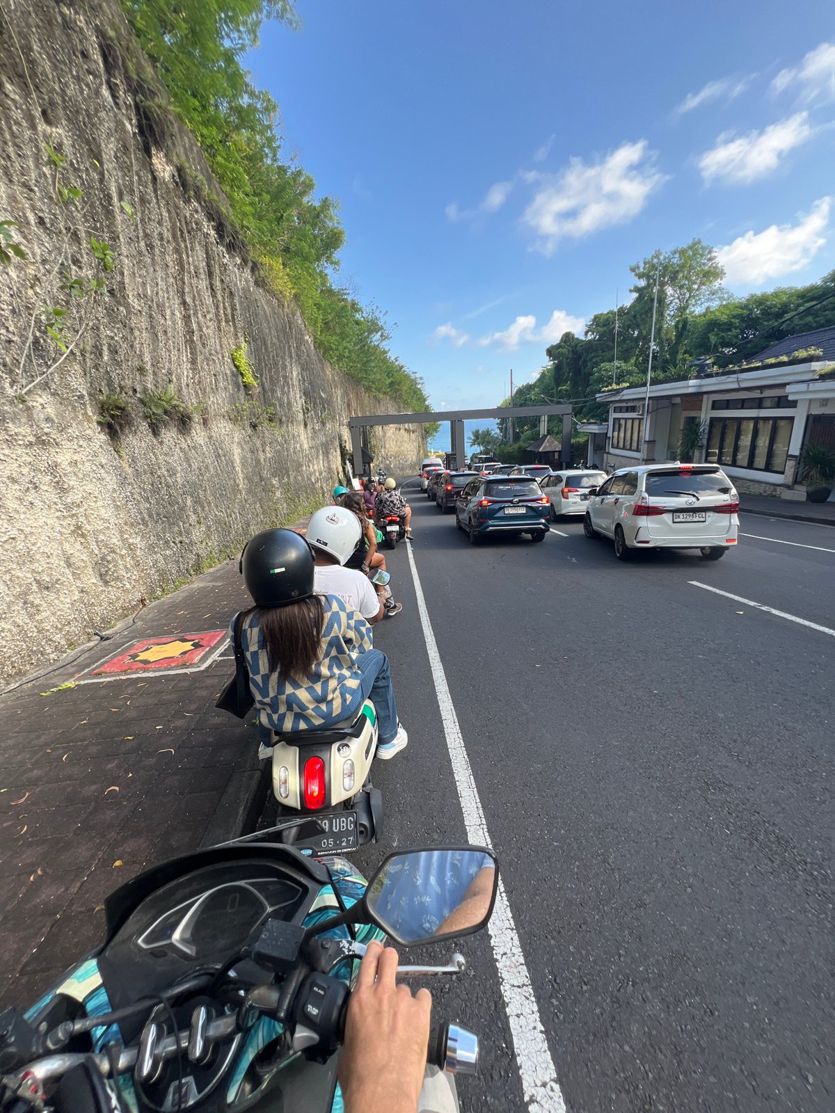 Morning scooter commute and traffic documented in Ungasan, Indonesia