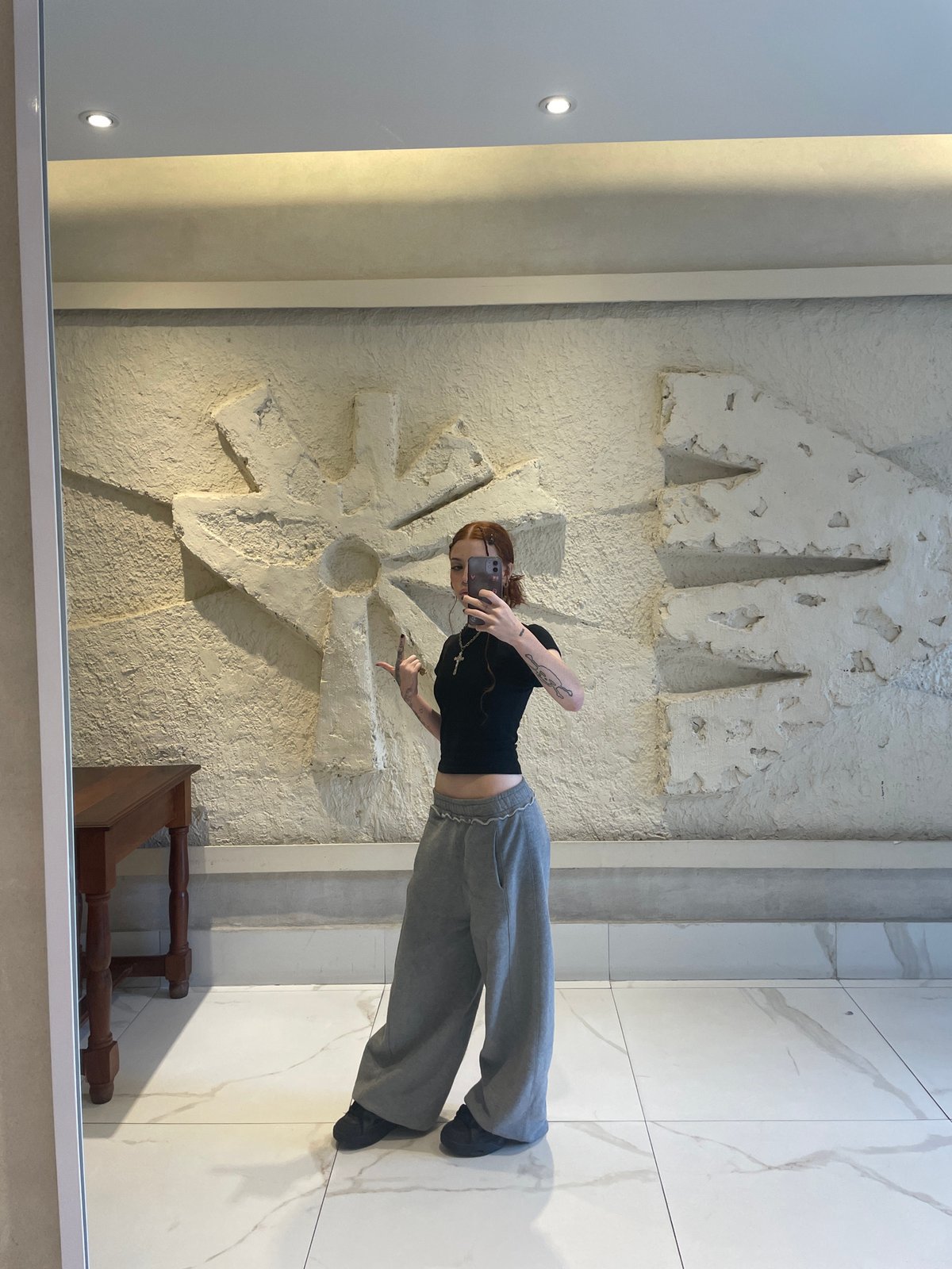 Buenos Aires resident documents elevator selfie, tattoo session