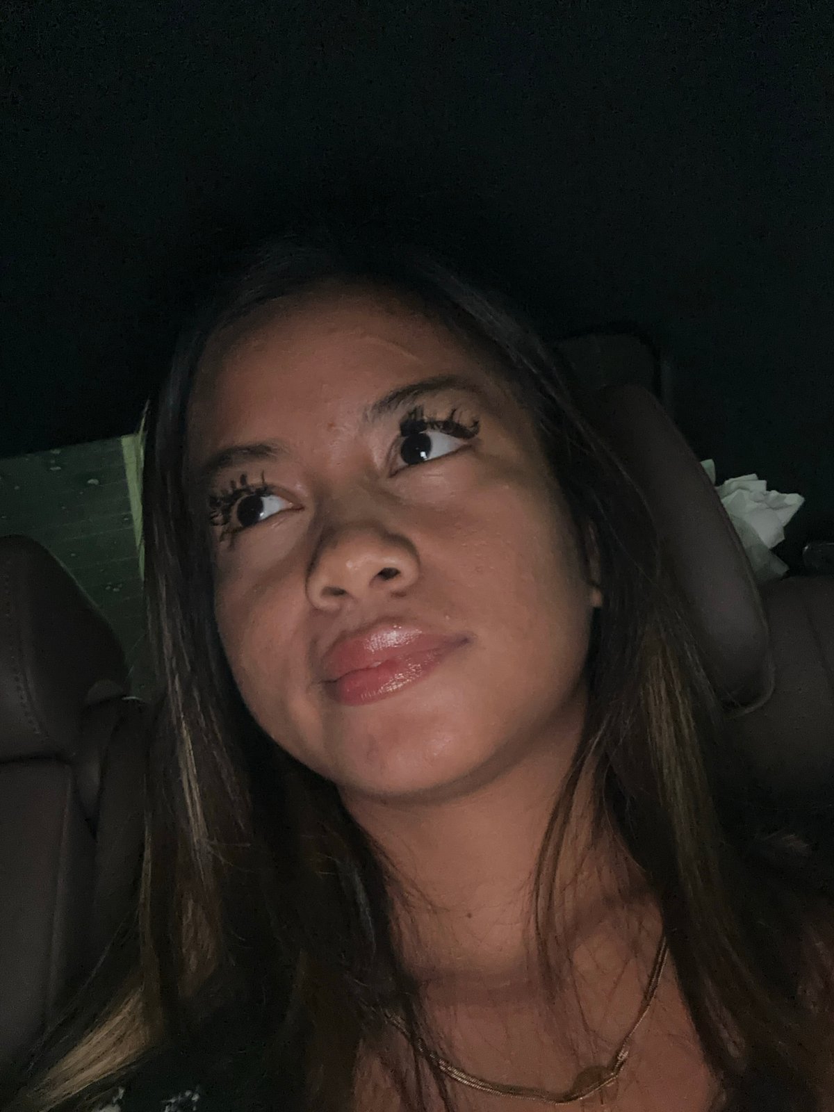 Woman photographed in car passenger seat in South Jakarta