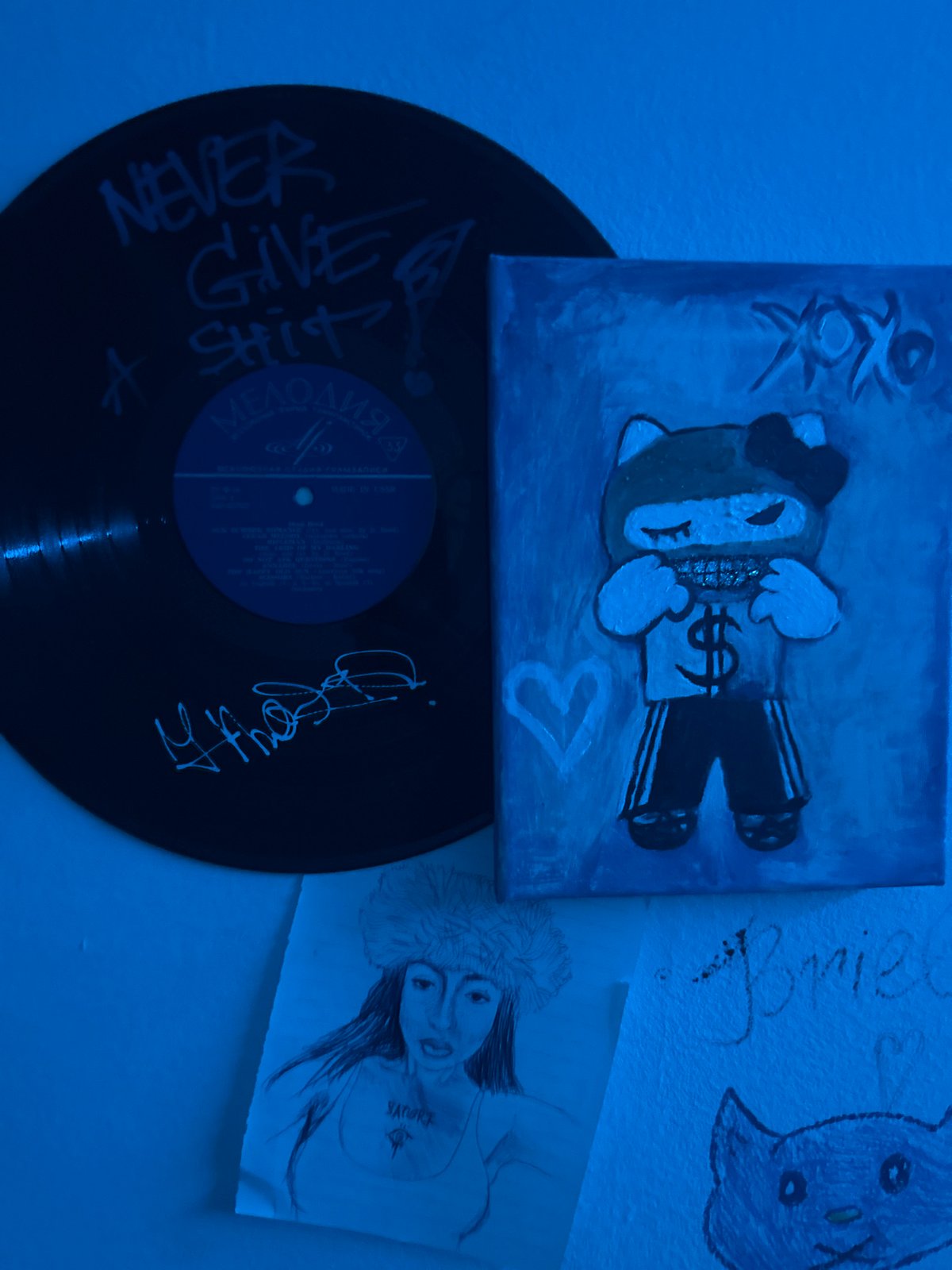 Recording studio space with blue walls and bear artwork documented