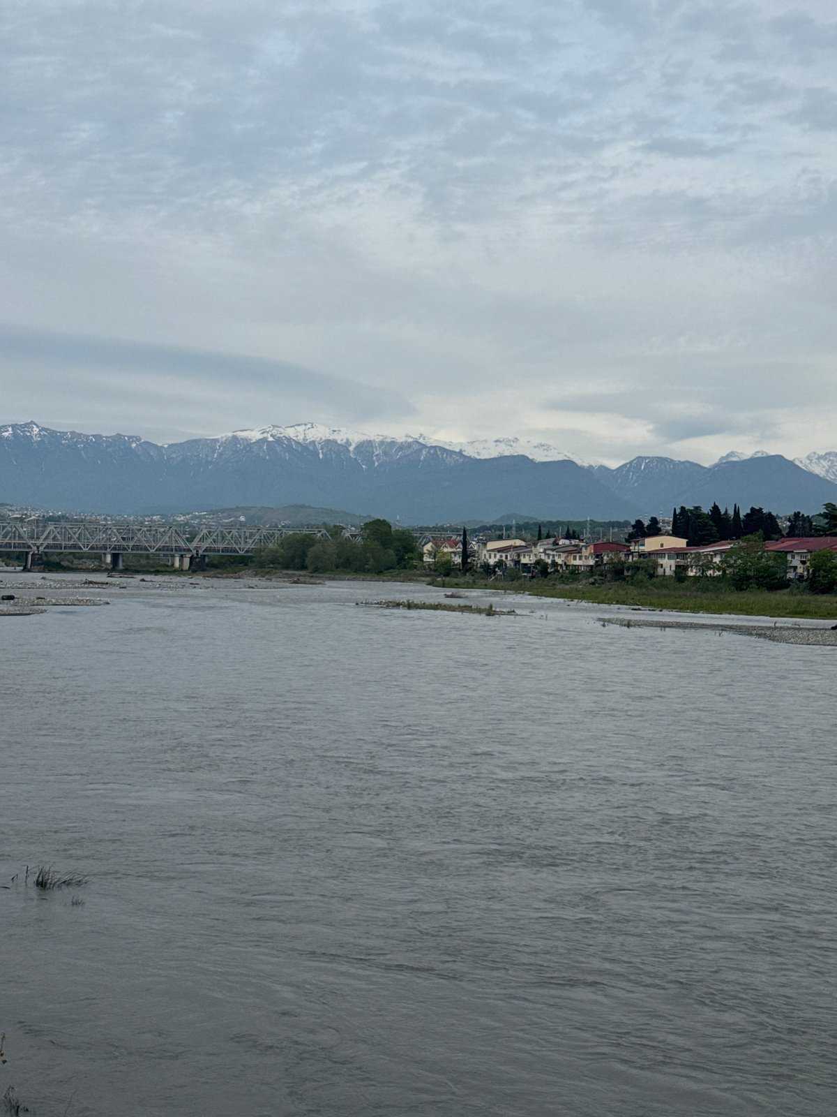 Afternoon riverside scenes captured along Sochi waterfront promenade