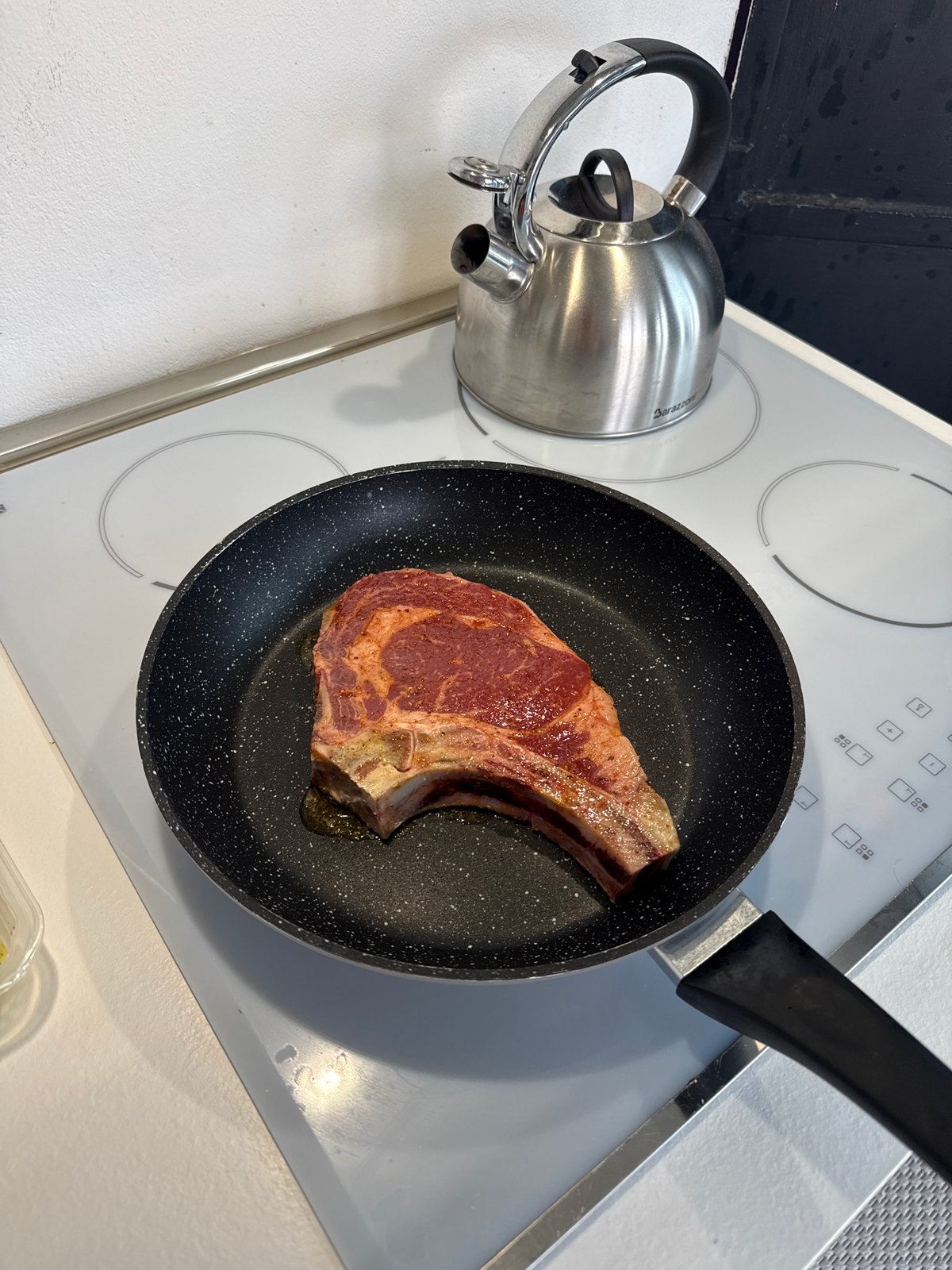 Milan resident prepares and serves bone-in steak lunch