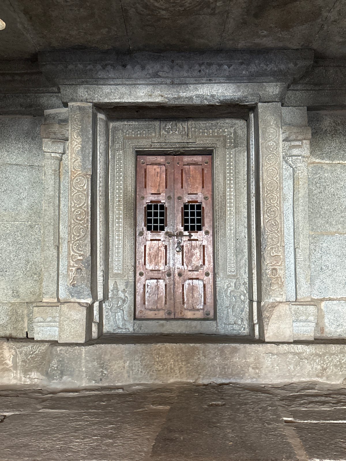 Visitor documents ancient temple architecture in Kamalapura, India