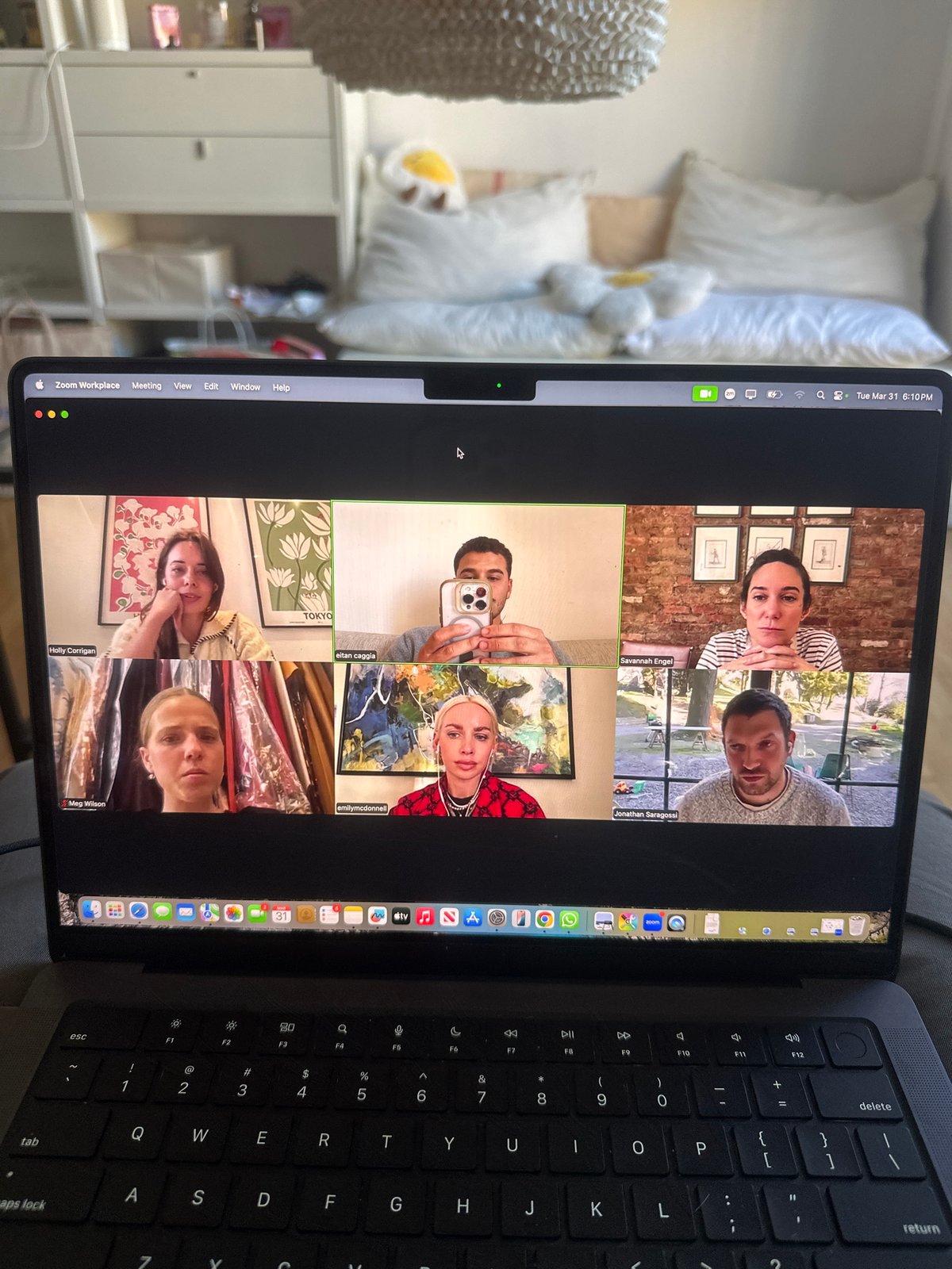 Six-person Zoom meeting observed on laptop in Milan