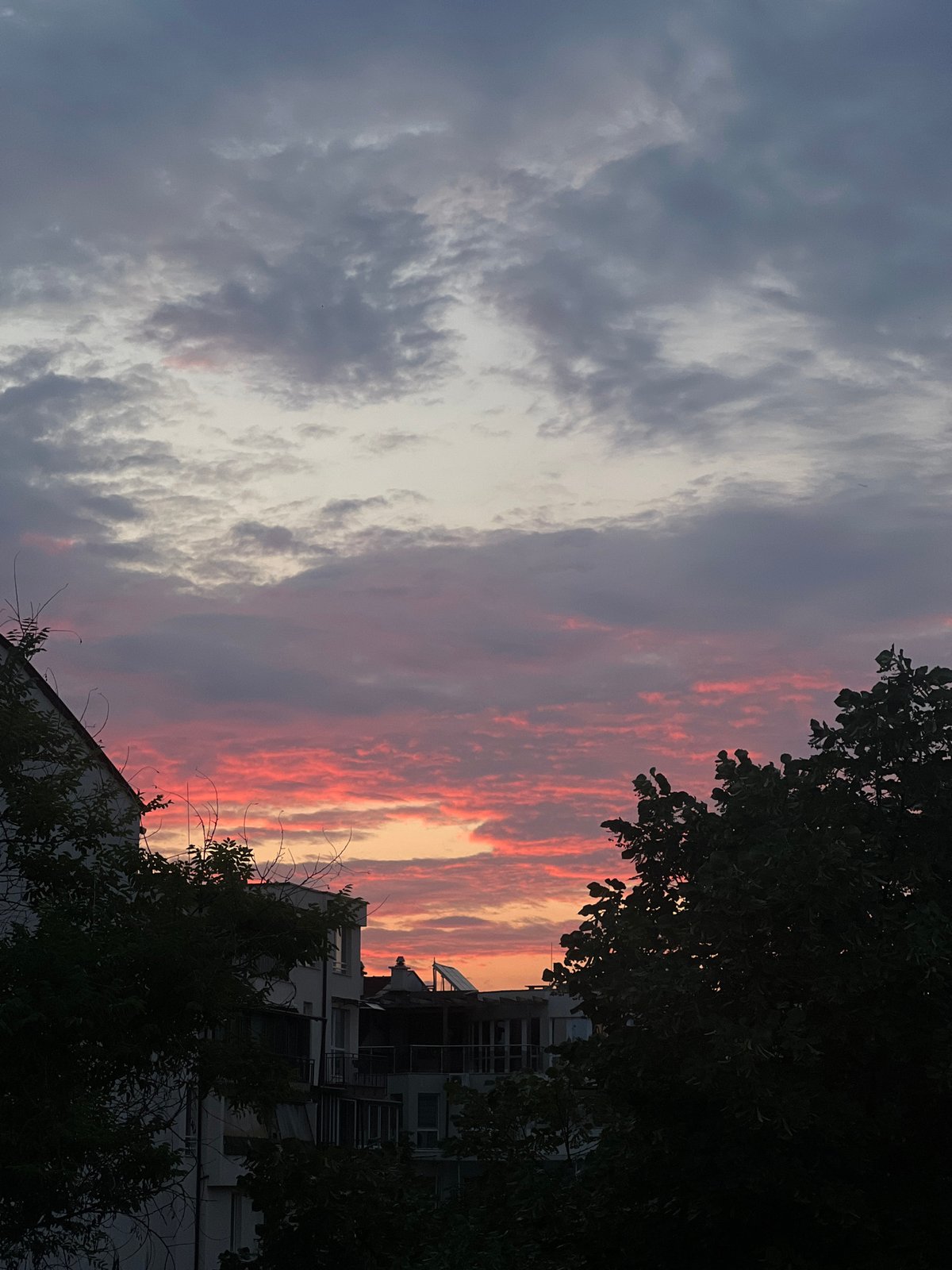 Vivid sunset paints the Plovdiv skyline in pink and orange