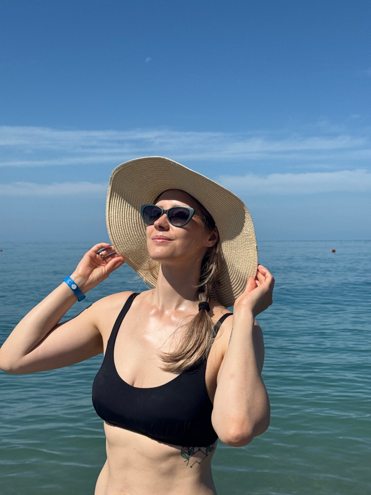 Beachgoer enjoys morning swim at Nebug, Russia Black Sea coast