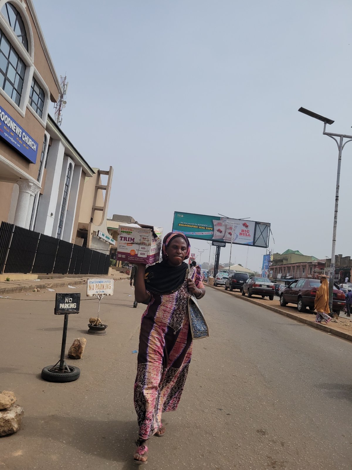 Midday street vendor activity documented in Jos, Nigeria