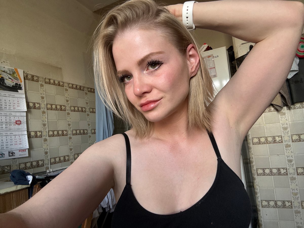 Woman Takes Mirror Selfies in Saint Petersburg Kitchen
