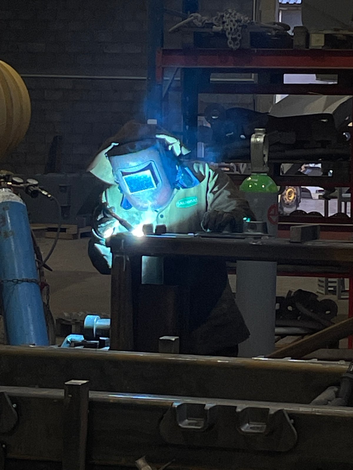 Welder in protective gear works industrial site Montenegro