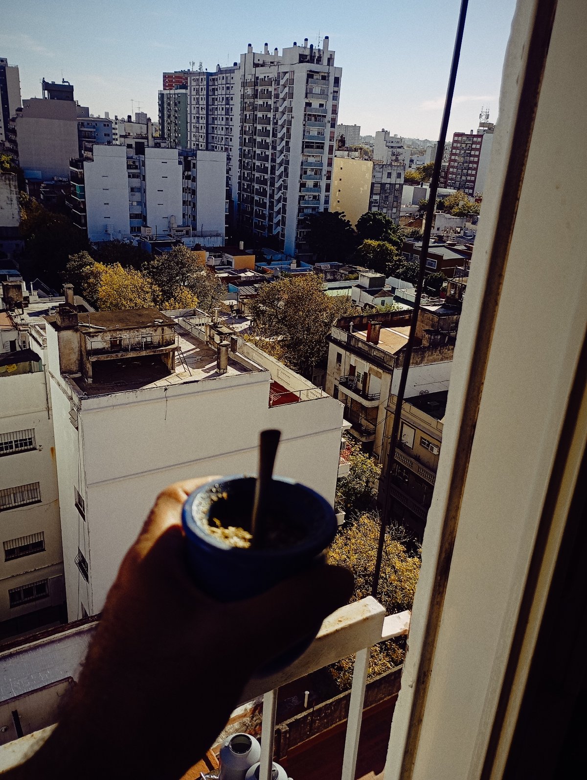 Buenos Aires resident documents evening routine, mate drinking, city views