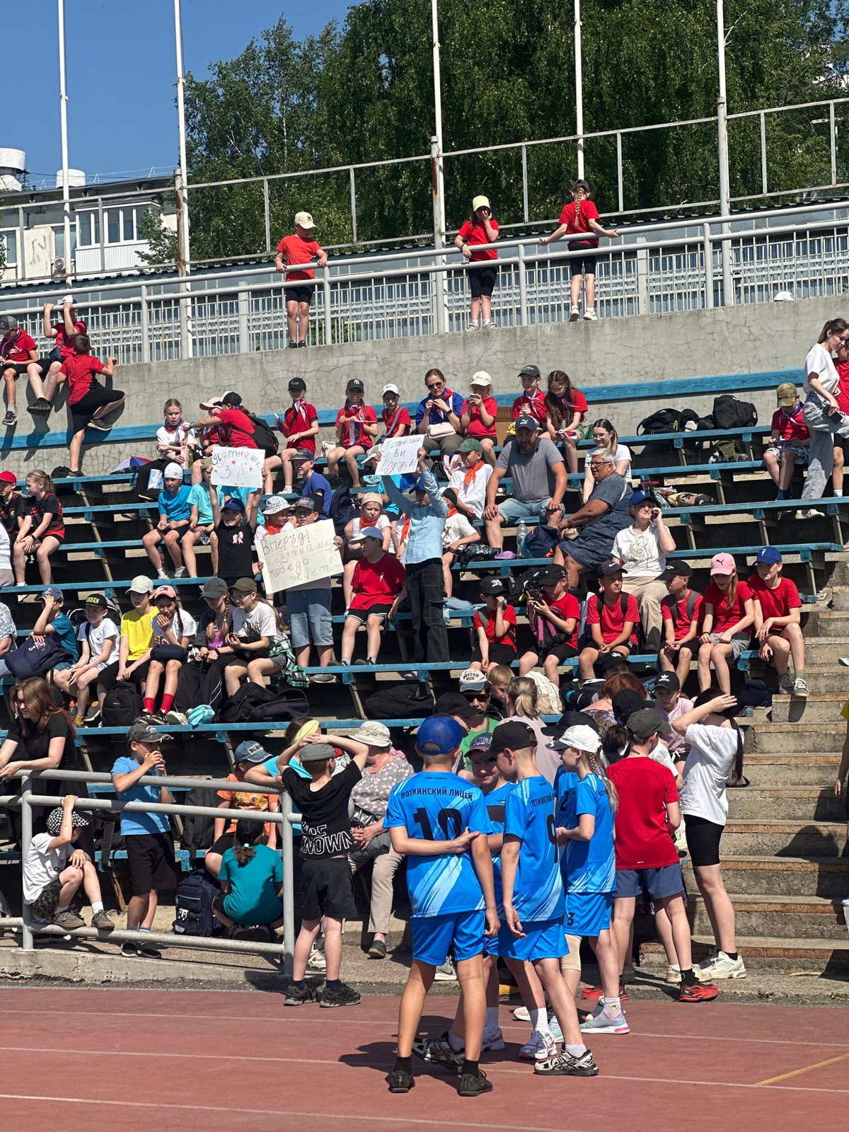 Sunny day scenes captured across Votkinsk stadium, cathedral, waterfront